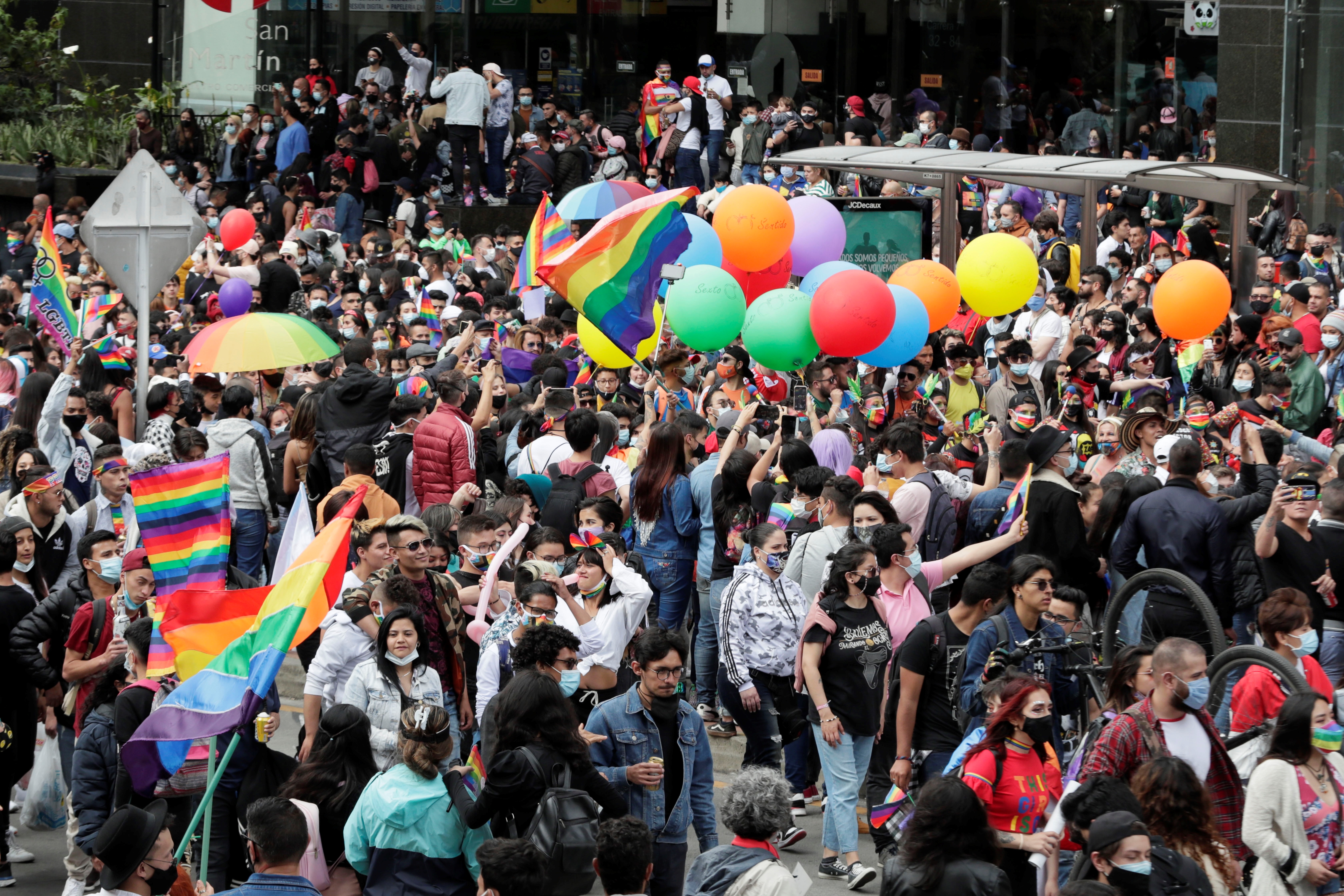 epa09322864 Members and supporters of the lesbian, gay, bisexual, transgender and intersex (LGBTI) community take part in the Pride parade through the streets of Bogota, Colombia, 04 July 2021.  EPA-EFE/Carlos Ortega