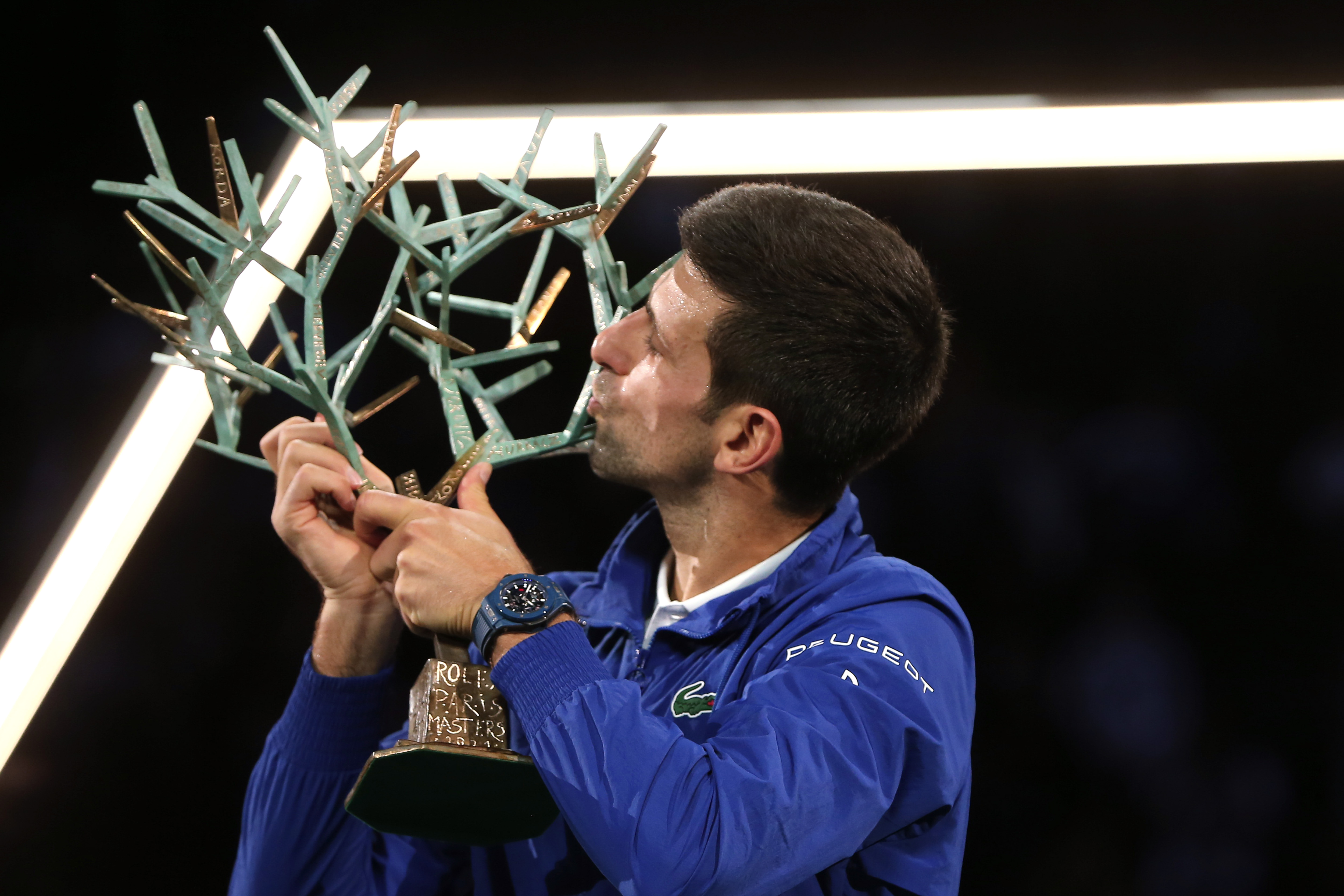 epa09570252 Novak Djokovic of Serbia celebrates with the trophy after winning the final match against Daniil Medvedev of Russia at the Rolex Paris Masters tennis tournament in Paris, France, 07 November 2021.  EPA-EFE/CHRISTOPHE PETIT TESSON