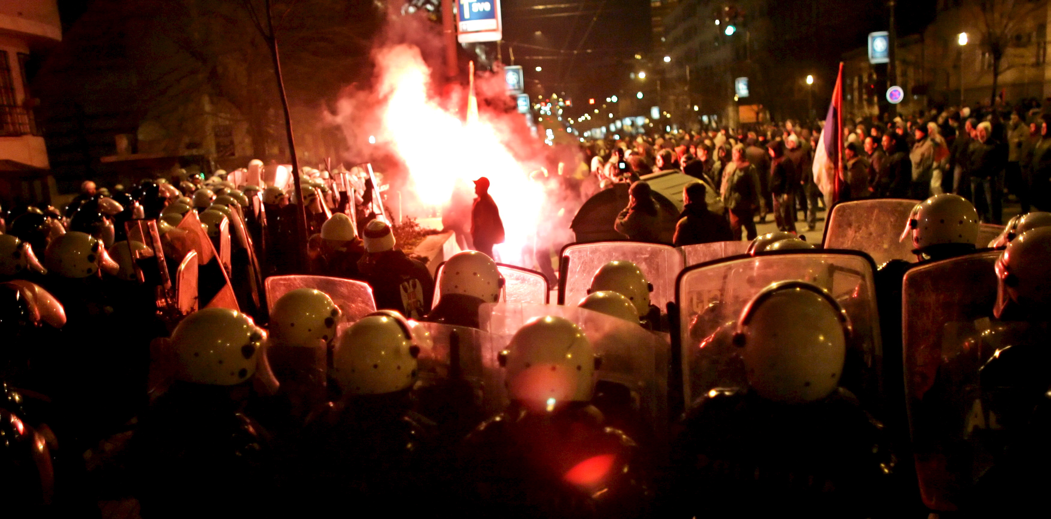 Serbian riot police clash with protesters in front of the US embassy in Belgrade