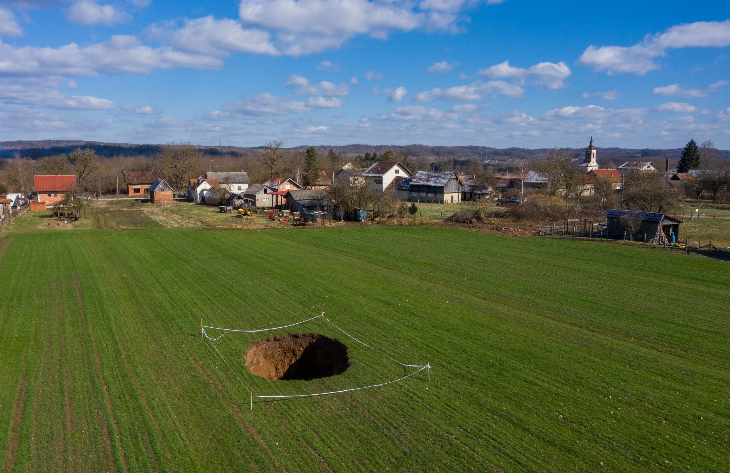 18022021 Sinkhole is seen in the field in village Mecencani, Croatia, February 12, 2021. Picture is taken with a drone on February 12, 2021. REUTERS/Antonio Bronic