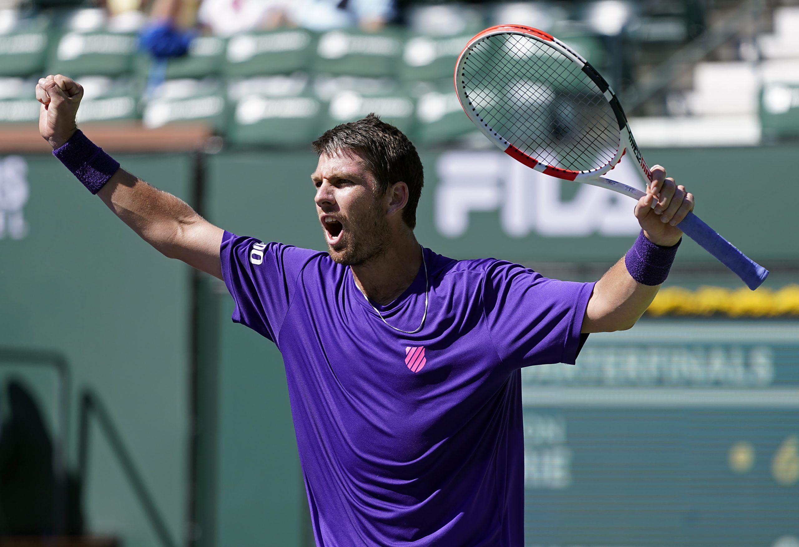 epa09524072 Cameron Norrie of Great Britain celebrates his win against Diego Schwartzman of Argentina at the BNP Paribas Open tennis tournament at the Indian Wells Tennis Garden in Indian Wells, California, USA, 14 October 2021.  EPA-EFE/RAY ACEVEDO