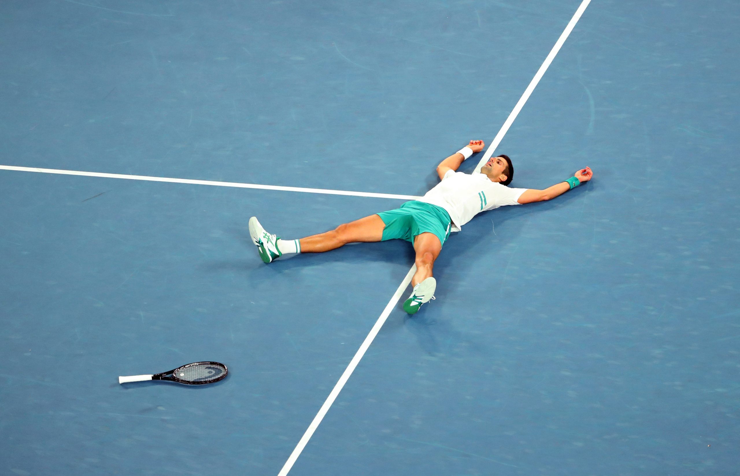 21022021 Tennis - Australian Open - Men's Singles Final - Melbourne Park, Melbourne, Australia, February 21, 2021 Serbia's Novak Djokovic celebrates winning his final match against Russia's Daniil Medvedev REUTERS/Kelly Defina
