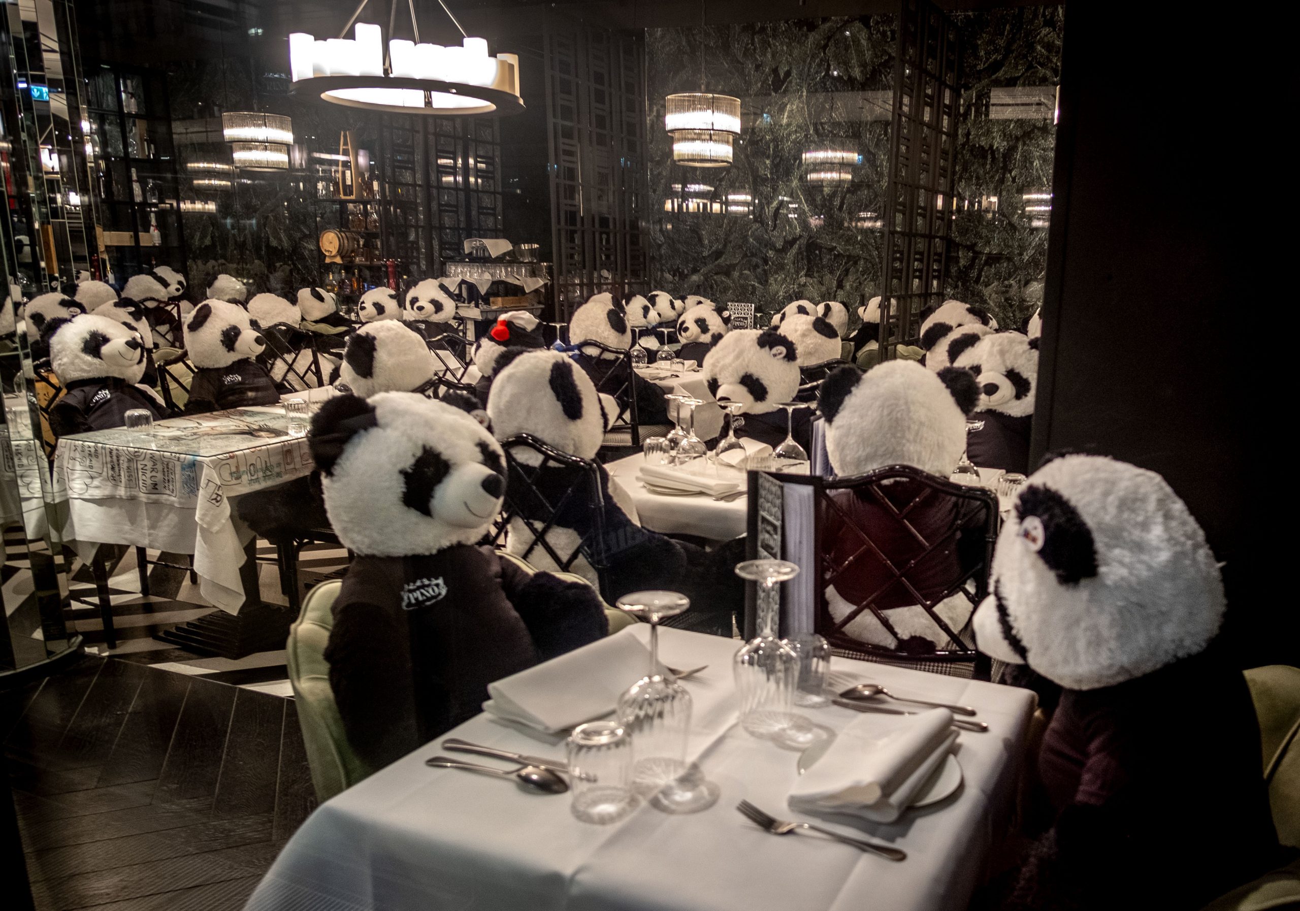 The owner of a closed restaurant has placed plush panda bears at the tables in central Frankfurt, Germany, Tuesday, Feb. 23, 2021, as Germany is still in a partiallockdown. (AP Photo/Michael Probst)