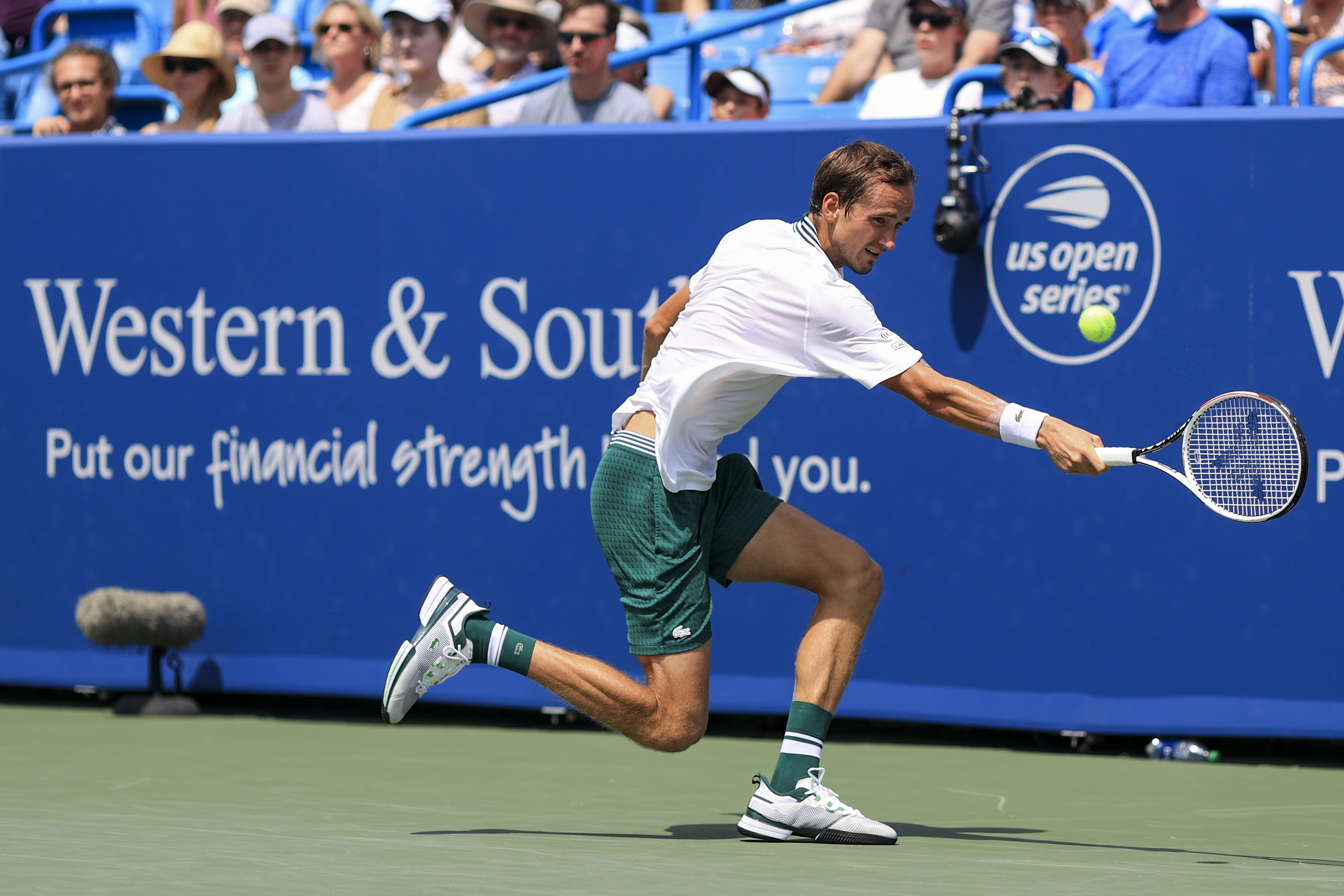 Daniil Medvedev, of Russia, returns to Andrey Rublev, of Russia, during the Western &amp; Southern Open tennis tournament, Saturday, Aug. 21, 2021, in Mason, Ohio. (AP Photo/Aaron Doster)