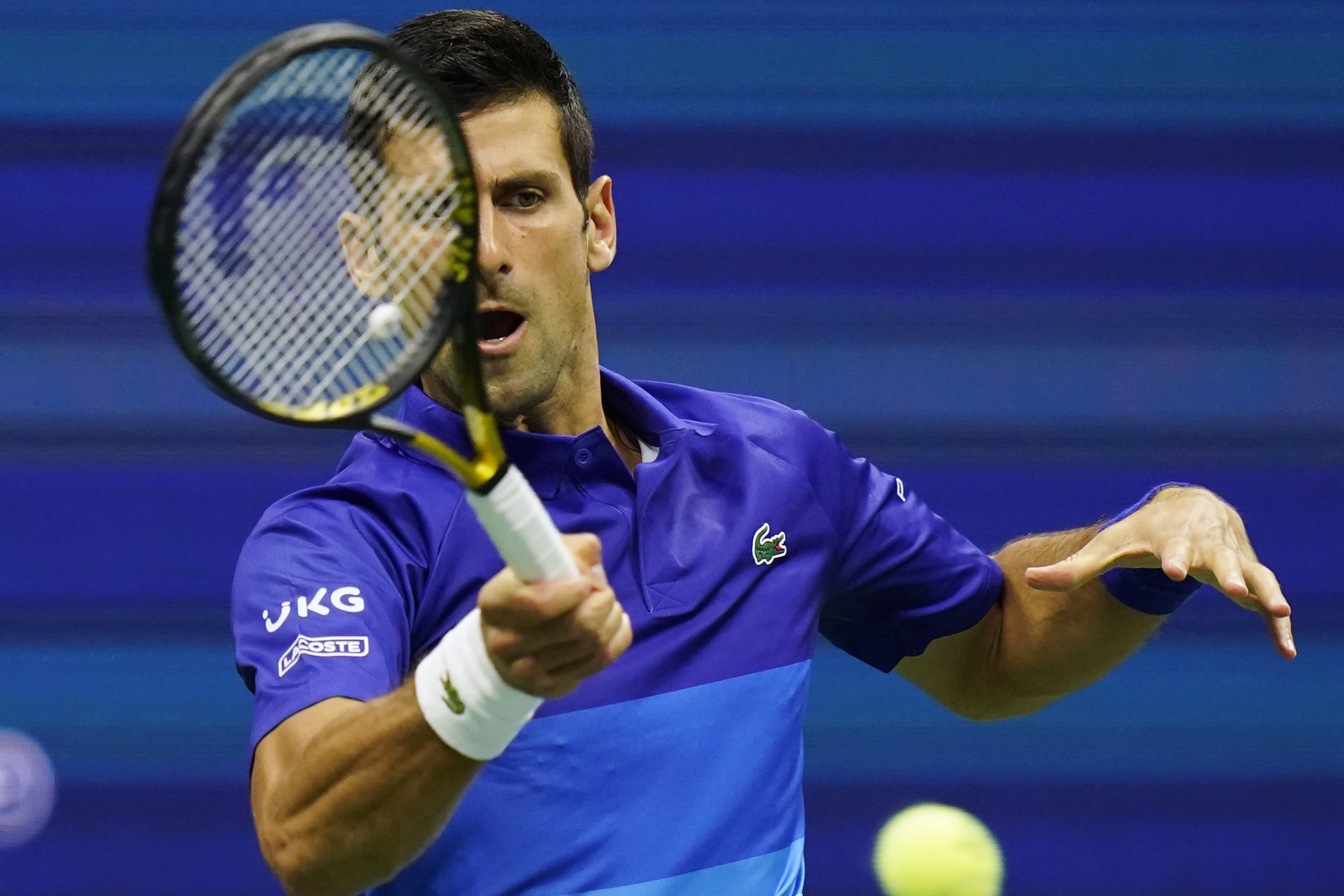 Novak Djokovic, of Serbia, returns a shot during the first round of the US Open tennis championships, Tuesday, Aug. 31, 2021, in New York. (AP Photo/Frank Franklin II)