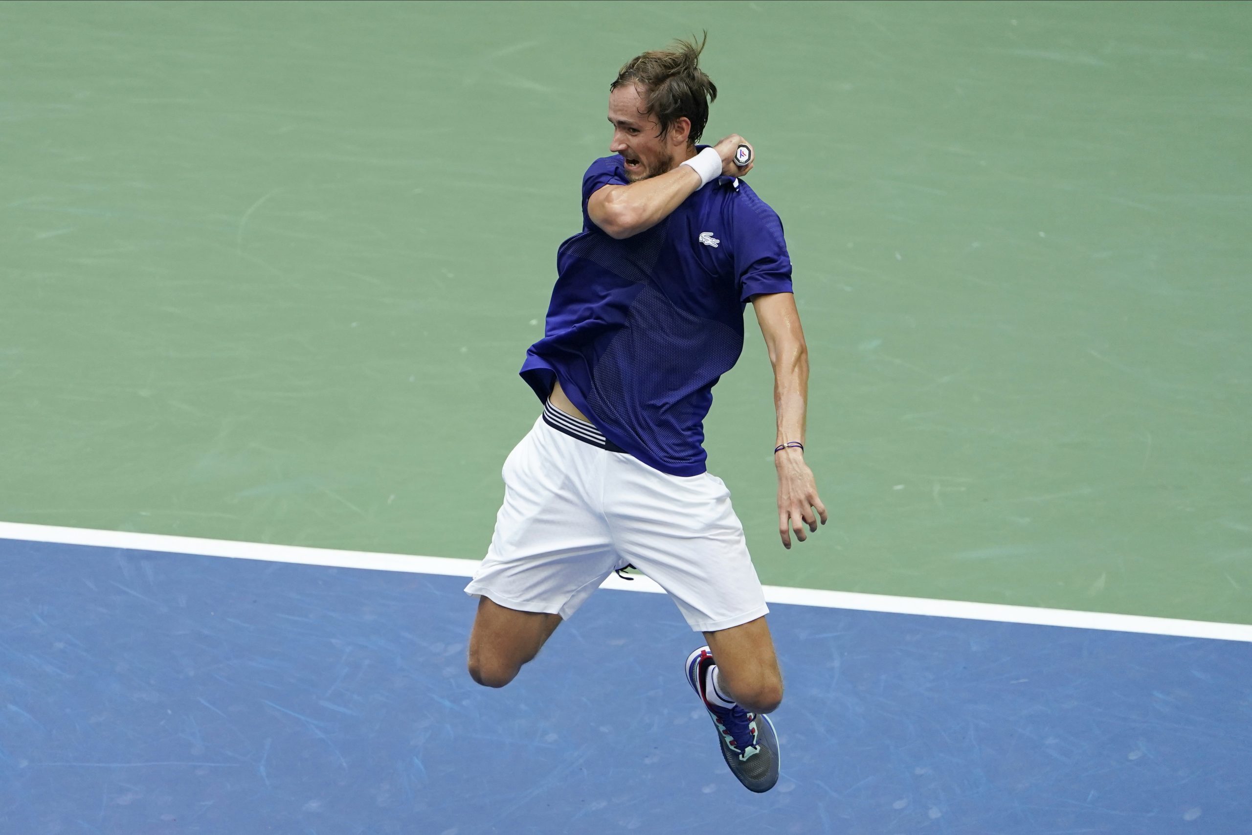 Daniil Medvedev, of Russia, returns a shot to Novak Djokovic, of Serbia, during the men's singles final of the US Open tennis championships, Sunday, Sept. 12, 2021, in New York. (AP Photo/Seth Wenig)