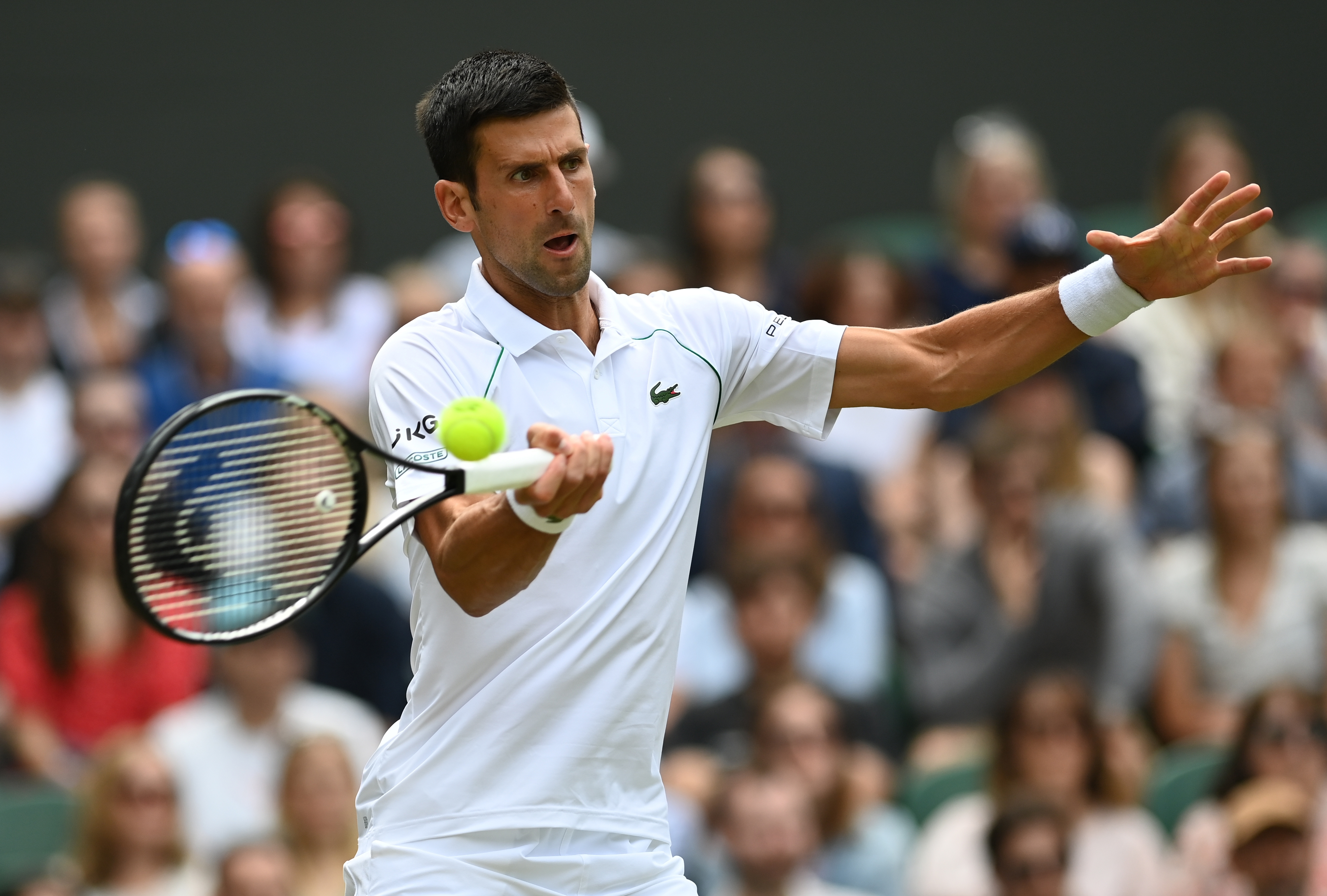epa09323700 Novak Djokovic of Serbia in action during his round of 16 match against Cristian Garin of Chile at the Wimbledon Championships, Wimbledon, Britain 05 July 2021.  EPA-EFE/NEIL HALL   EDITORIAL USE ONLY
