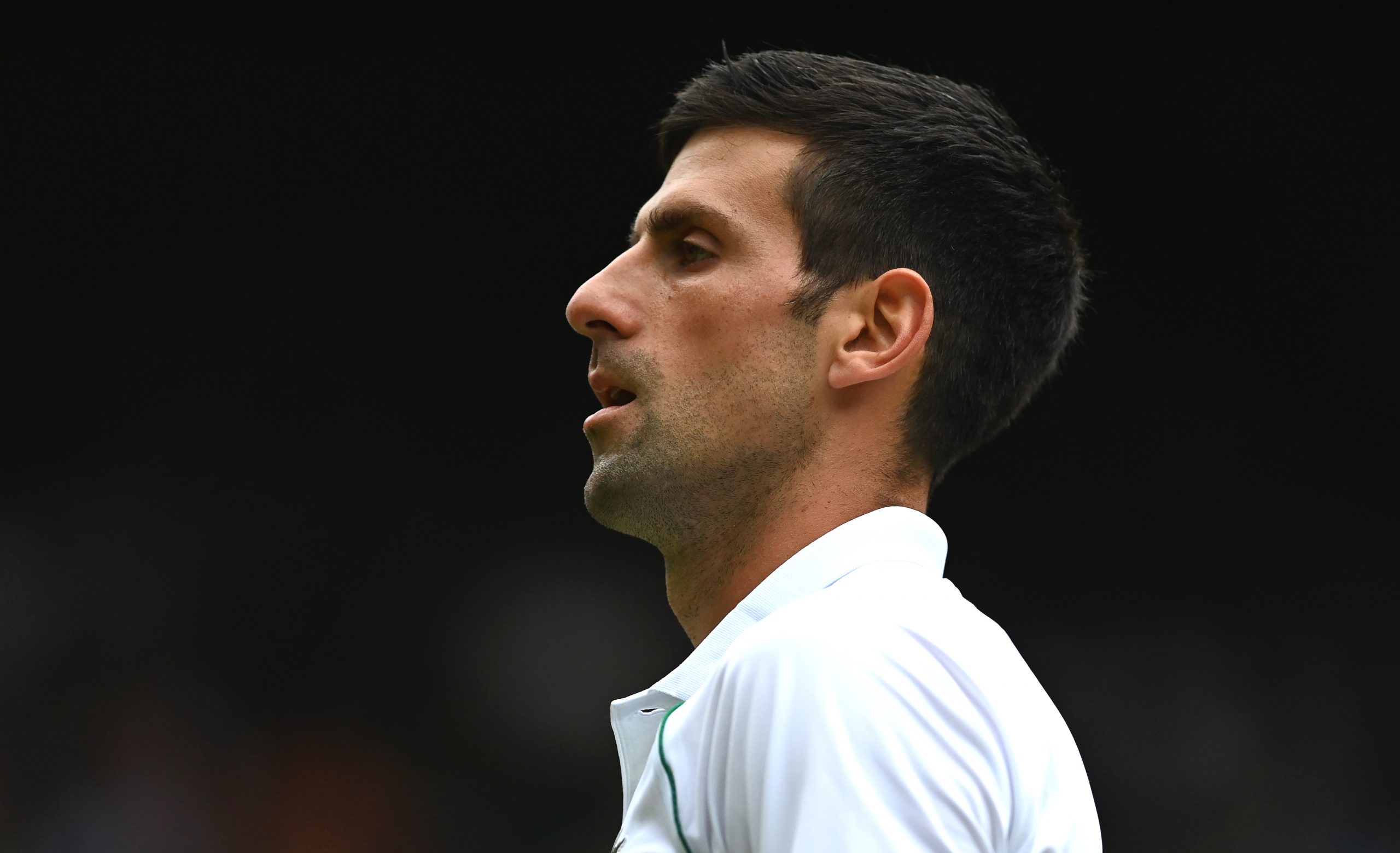 epa09334157 Novak Djokovic of Serbia reacts during his men's semi final match against Denis Shapovalov of Canada at the Wimbledon Championships in Wimbledon, Britain, 09 July 2021.  EPA-EFE/NEIL HALL   EDITORIAL USE ONLY