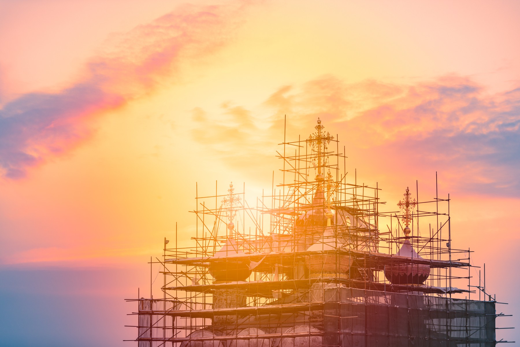 Church restoration in Russia at sunset. Orange cloudy sky in background.,Image: 528523389, License: Royalty-free, Restrictions: , Model Release: no, Credit line: Konstantin Yolshin / Panthermedia / Profimedia