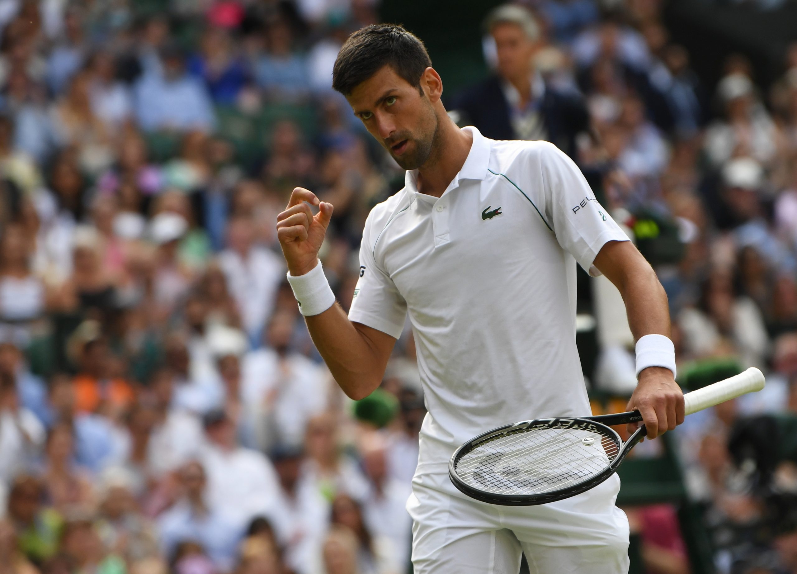 epa09337573 Novak Djokovic of Serbia reacts during the men's final against Matteo Berrettini of Italy at the Wimbledon Championships, Wimbledon, Britain 11 July 2021.  EPA-EFE/NEIL HALL   EDITORIAL USE ONLY