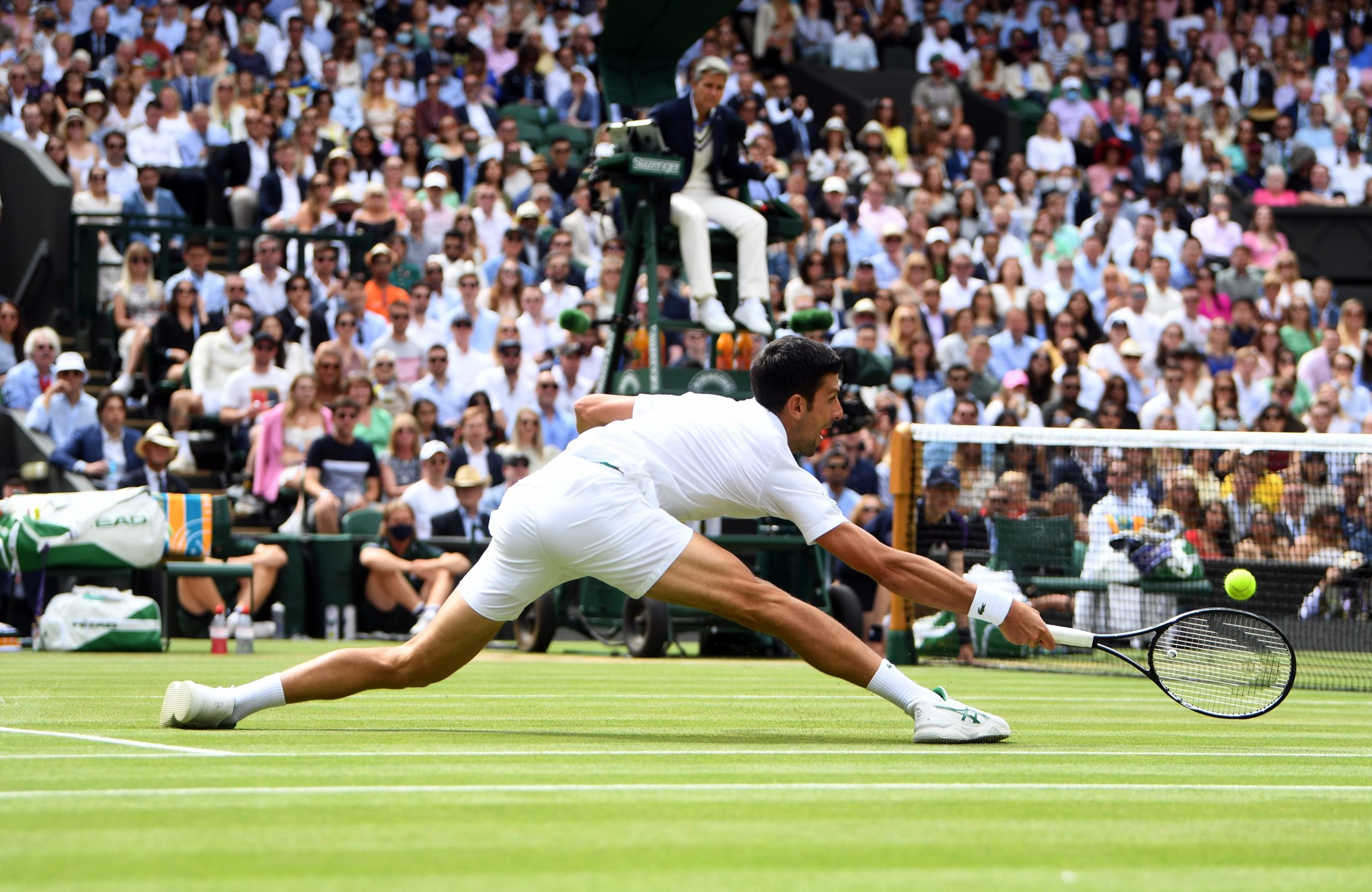 epa09337245 Novak Djokovic of Serbia in action against Matteo Berrettini of Italy during the men's final at the Wimbledon Championships, Wimbledon, Britain 11 July 2021.  EPA-EFE/NEIL HALL   EDITORIAL USE ONLY