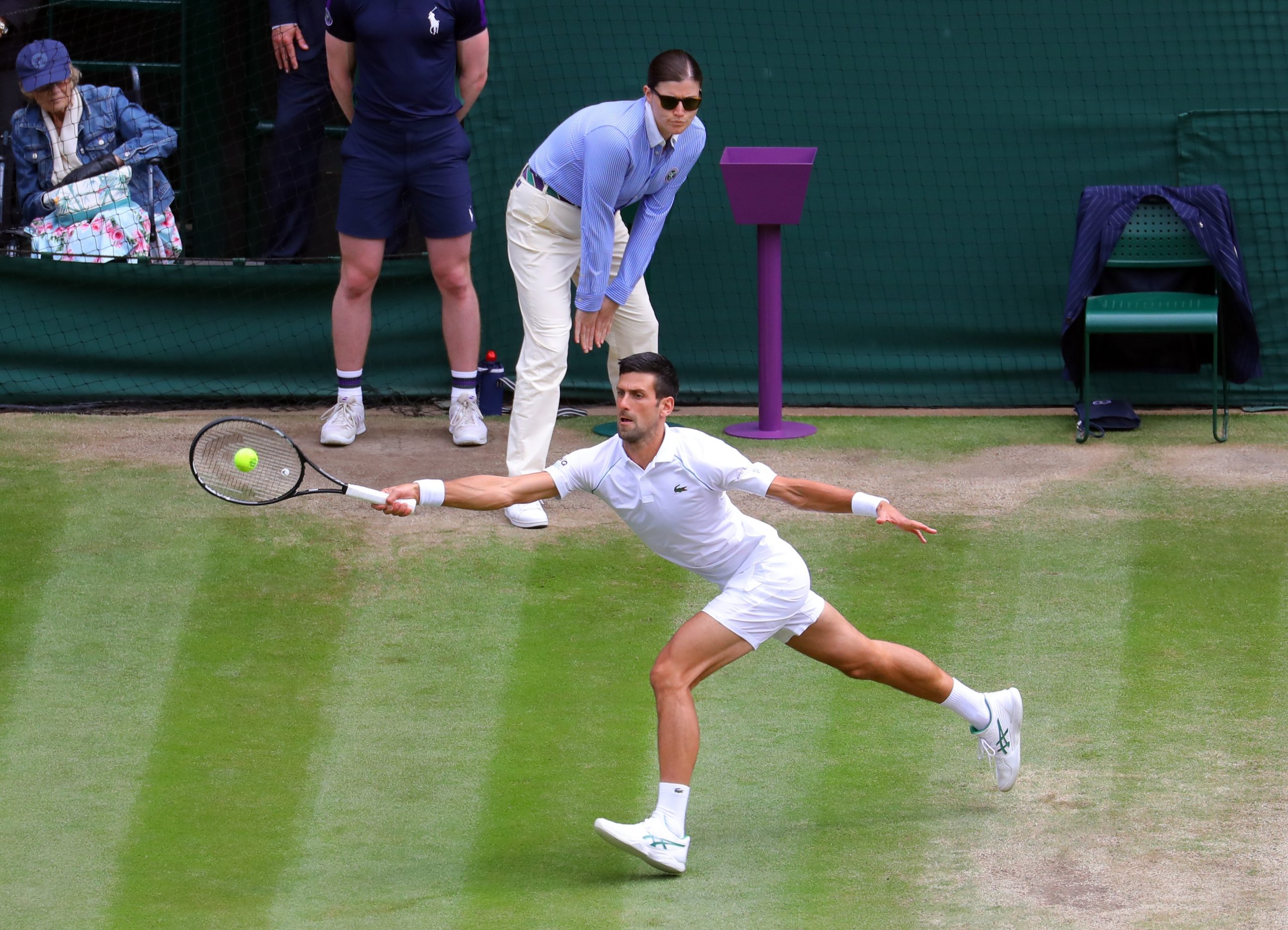 epa09337170 Novak Djokovic of Serbia in action against Matteo Berrettini of Italy during the men's final at the Wimbledon Championships, Wimbledon, Britain 11 July 2021.  EPA-EFE/VICKIE FLORES   EDITORIAL USE ONLY