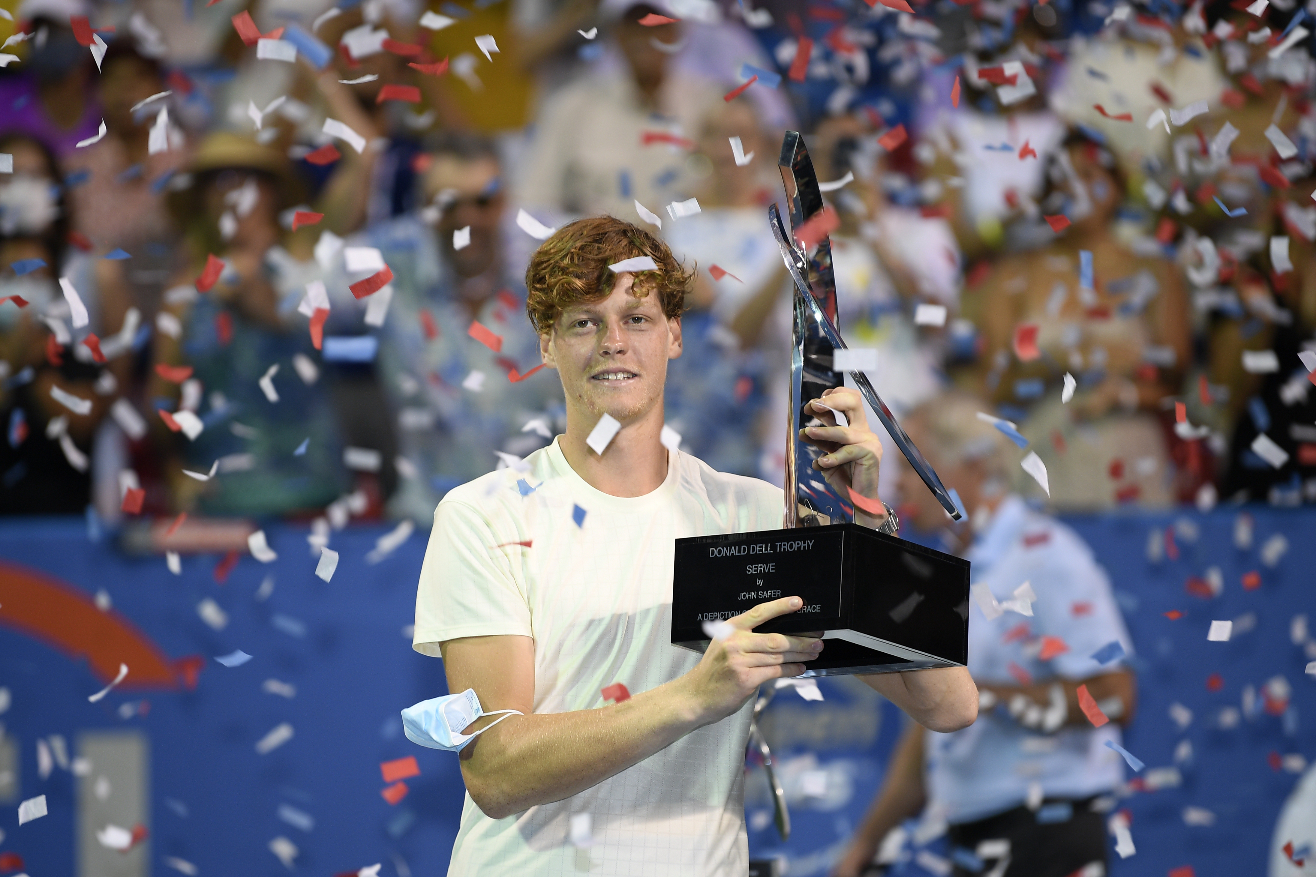 Jannik Sinner, of Italy, poses with the trophy after he beat Mackenzie McDonald, of the United States, during the singles final at the Citi Open tennis tournament Sunday, Aug. 8, 2021, in Washington. Sinner won 7-5, 4-6, 7-5. (AP Photo/Nick Wass)