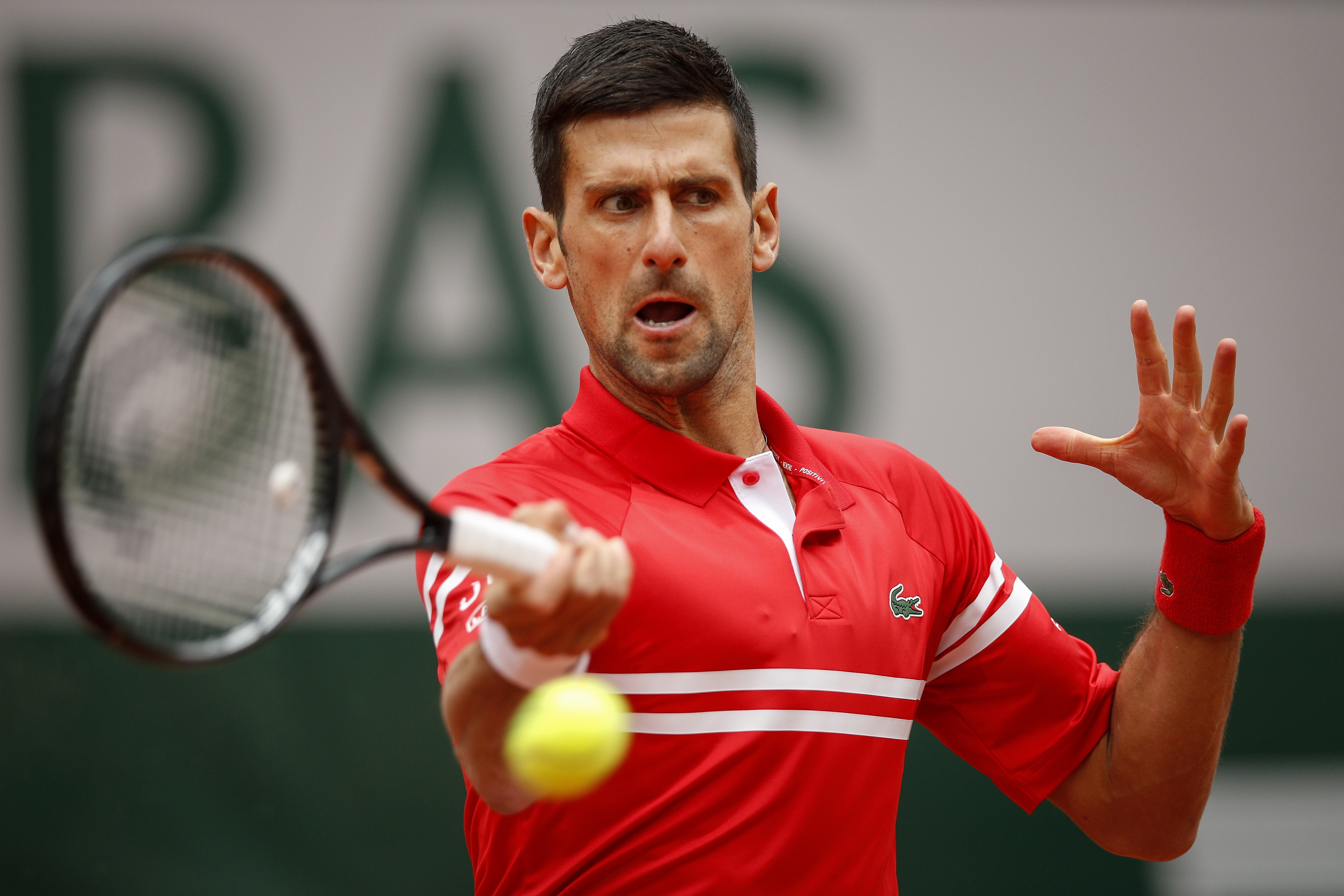 epa09249281 Novak Djokovic of Serbia in action during the 3rd round match against Ricardas Berankis of Lithuania at the French Open tennis tournament at Roland Garros in Paris, France, 05 June 2021.  EPA-EFE/YOAN VALAT