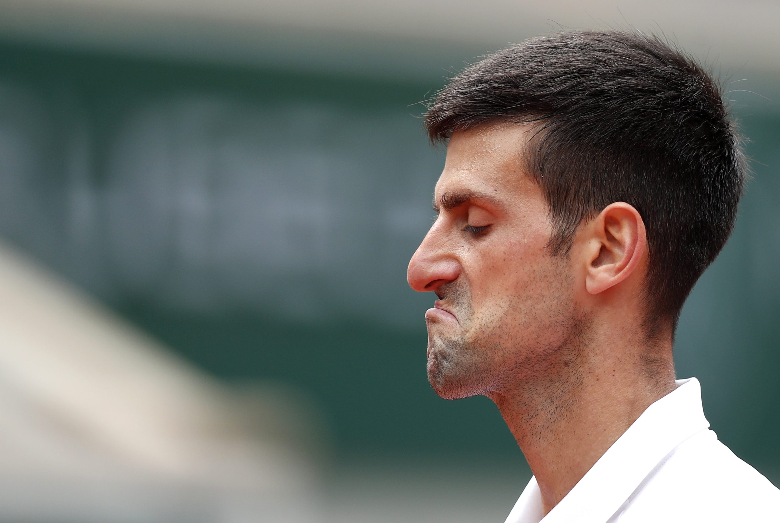 epa09253131 Novak Djokovic of Serbia reacts during the 4th round match against Lorenzo Musetti of Italy at the French Open tennis tournament at Roland Garros in Paris, France, 07 June 2021.  EPA-EFE/IAN LANGSDON