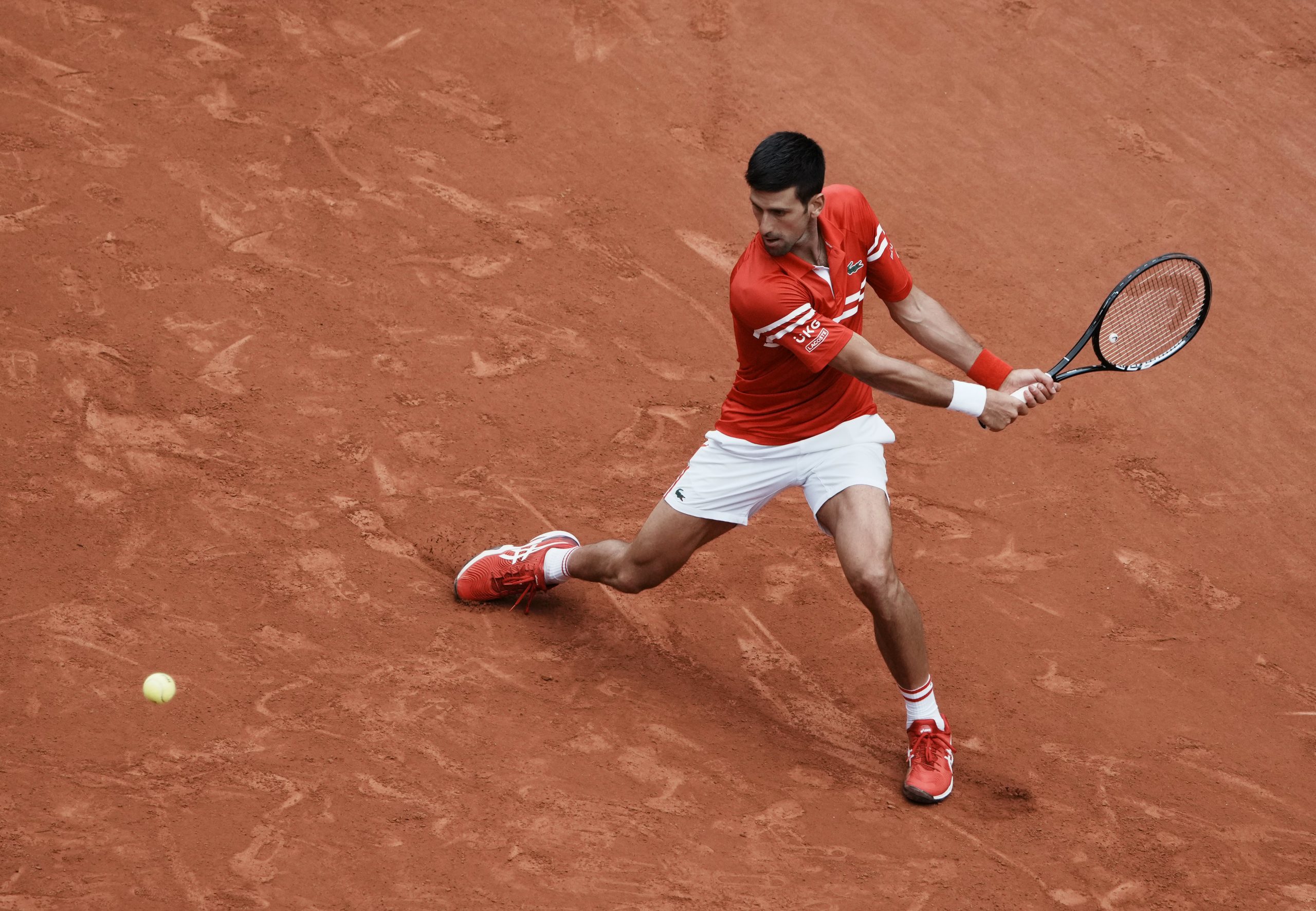 Serbia's Novak Djokovic plays a return to Lithuania's Ricardas Berankis during their third round match on day 7, of the French Open tennis tournament at Roland Garros in Paris, France, Saturday, June 5, 2021. (AP Photo/Thibault Camus)
