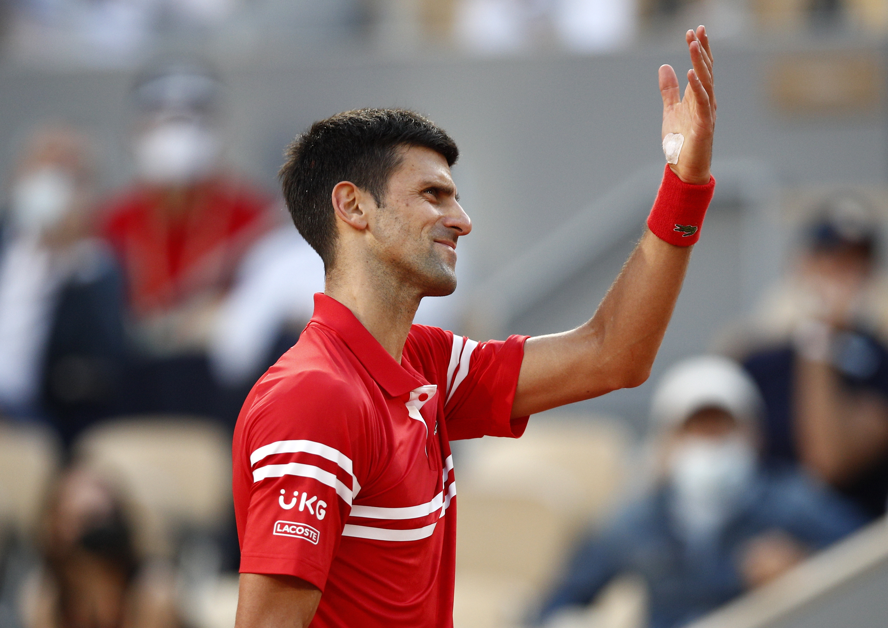 epa09263034 Novak Djokovic of Serbia in action against Rafael Nadal of Spain during their semi final match at the French Open tennis tournament at Roland Garros in Paris, France, 11 June 2021.  EPA-EFE/YOAN VALAT