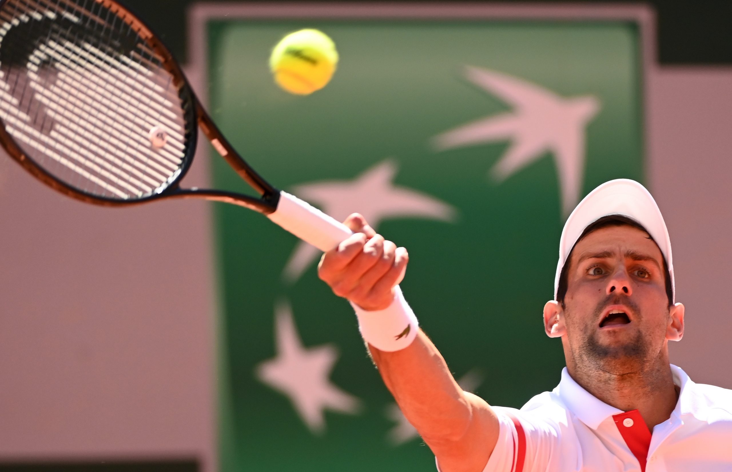 epa09267216 Novak Djokovic of Serbia in action against Stefanos Tsitsipas of Greece during their final match at the French Open tennis tournament at Roland Garros in Paris, France, 13 June 2021.  EPA-EFE/CAROLINE BLUMBERG