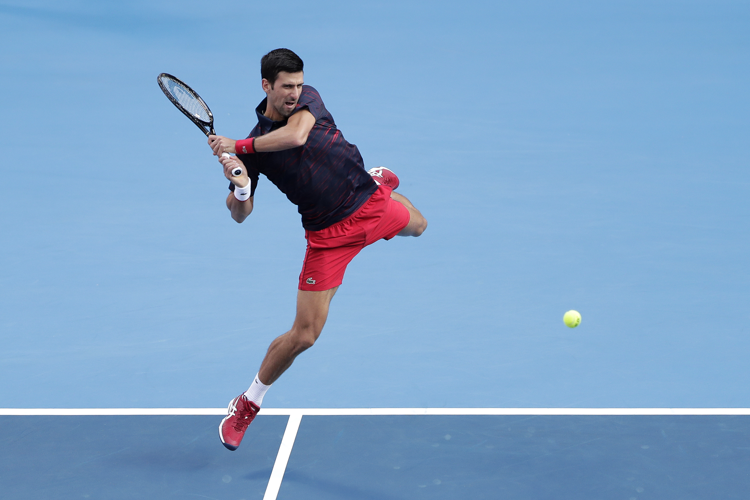 epa07900414 Novak Djokovic of Serbia in action against John Millman of Australia during the men's singles final match at the Japan Open Tennis Championships in Tokyo, Japan, 06 October 2019.  EPA-EFE/KIYOSHI OTA