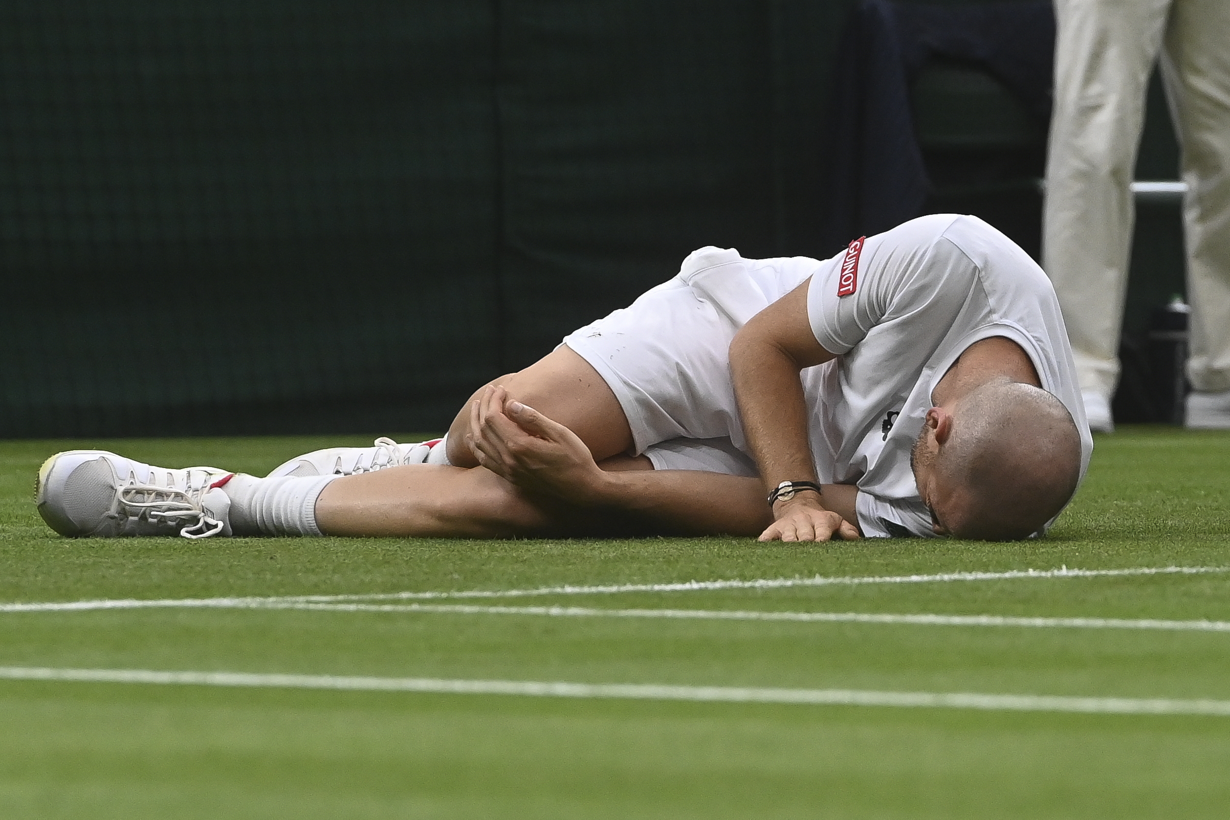epa09311577 Adrian Mannarino of France reacts during his first round match  against Roger Federer of Switzerland at the Wimbledon Championships tennis tournament in Wimbledon, Britain, 29 June 2021.  EPA-EFE/FACUNDO ARRIZABALAGA   EDITORIAL USE ONLY