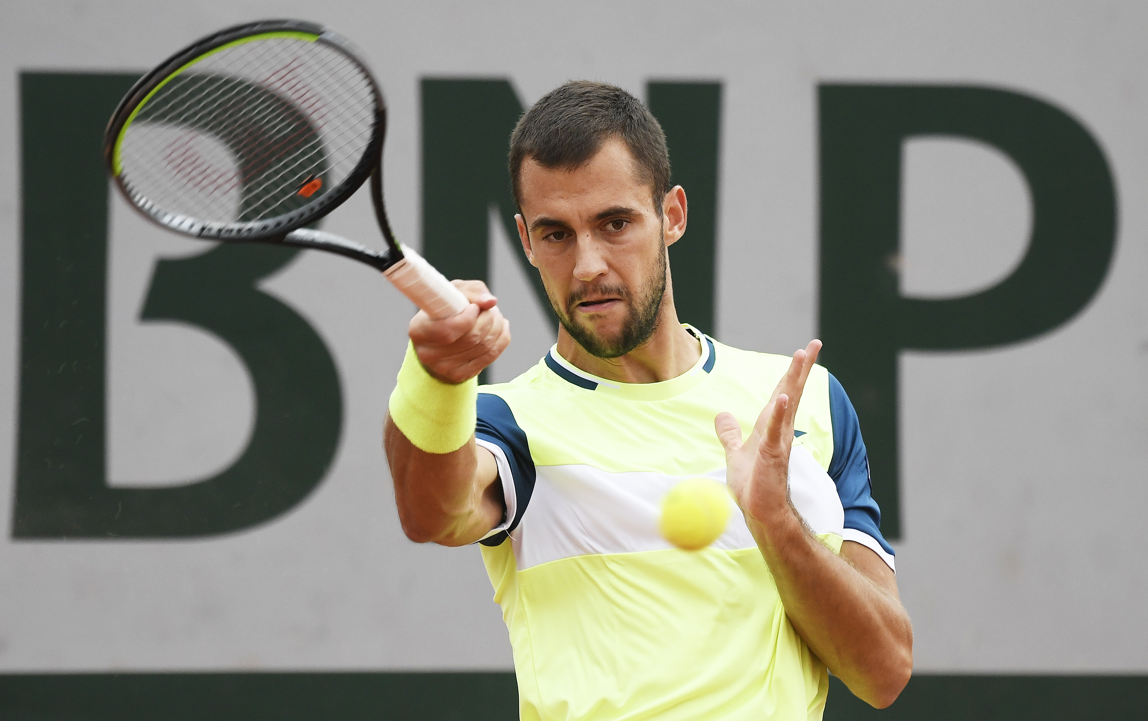epa08706045 Laslo Dere of Serbia hits a forehand during his first round match against Kevin Anderson of South Africa the French Open tennis tournament at Roland Garros in Paris, France, 29 September 2020.  EPA-EFE/JULIEN DE ROSA