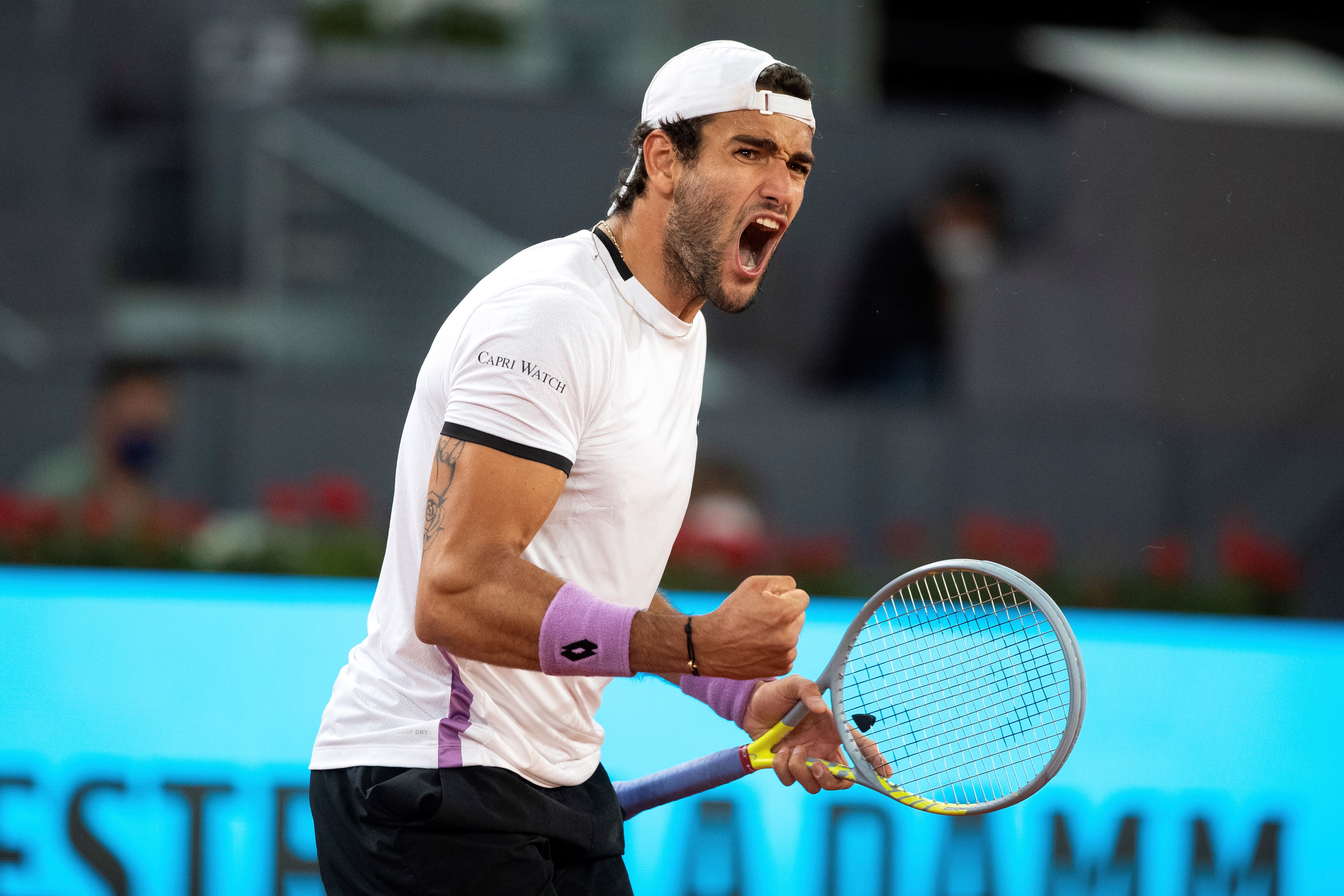 epa09184323 Matteo Berrettini of Italy in action against Christian Garin of Chile during their Mutua Madrid Open quarter final match held in Madrid, Spain, 07 May 2021.  EPA-EFE/RODRIGO JIMENEZ