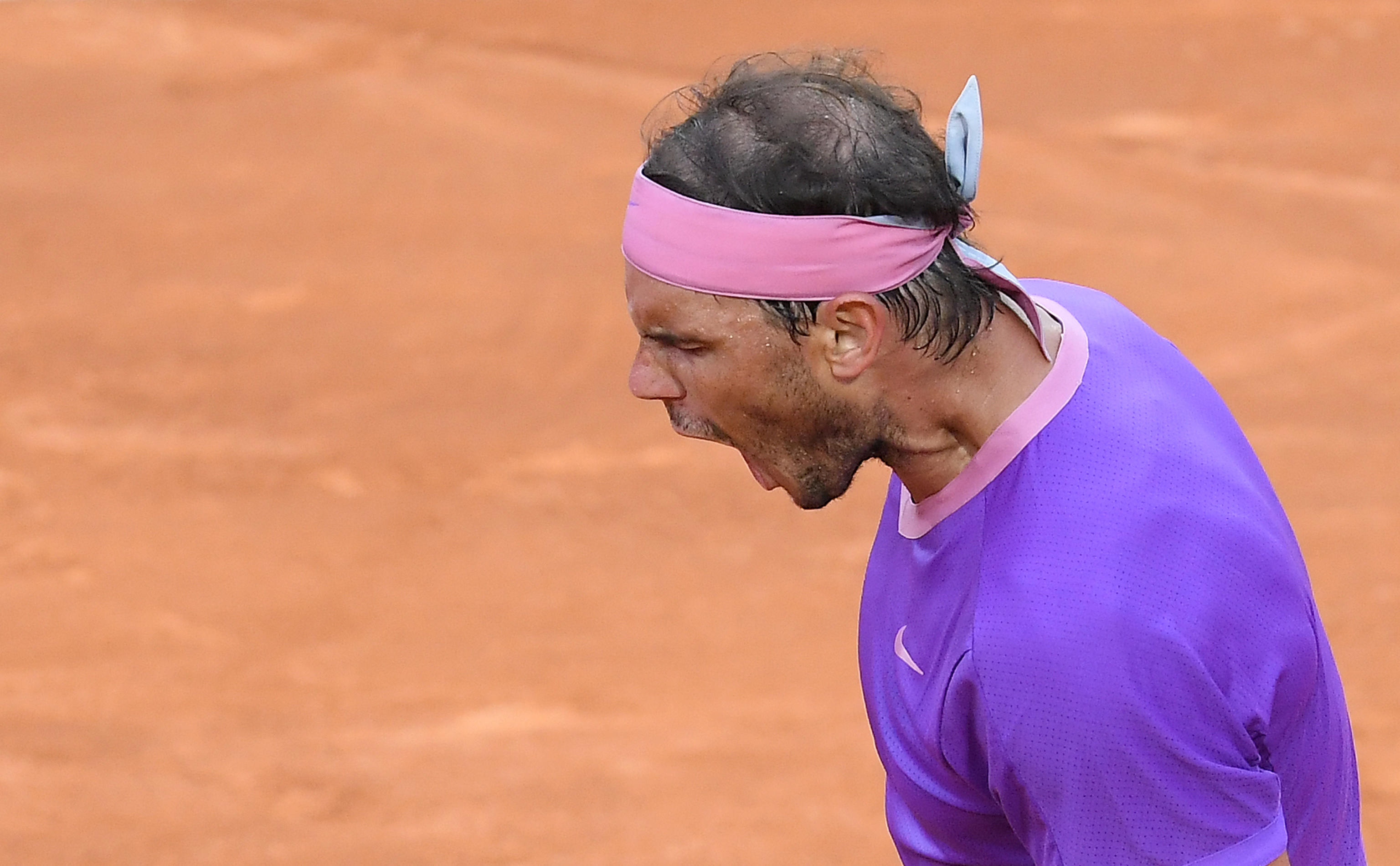 epa09205017 Rafael Nadal of Spain reacts during his men's singles final against Novak Djokovic of Serbia at the Italian Open tennis tournament in Rome, Italy, 16 May 2021.  EPA-EFE/ETTORE FERRARI