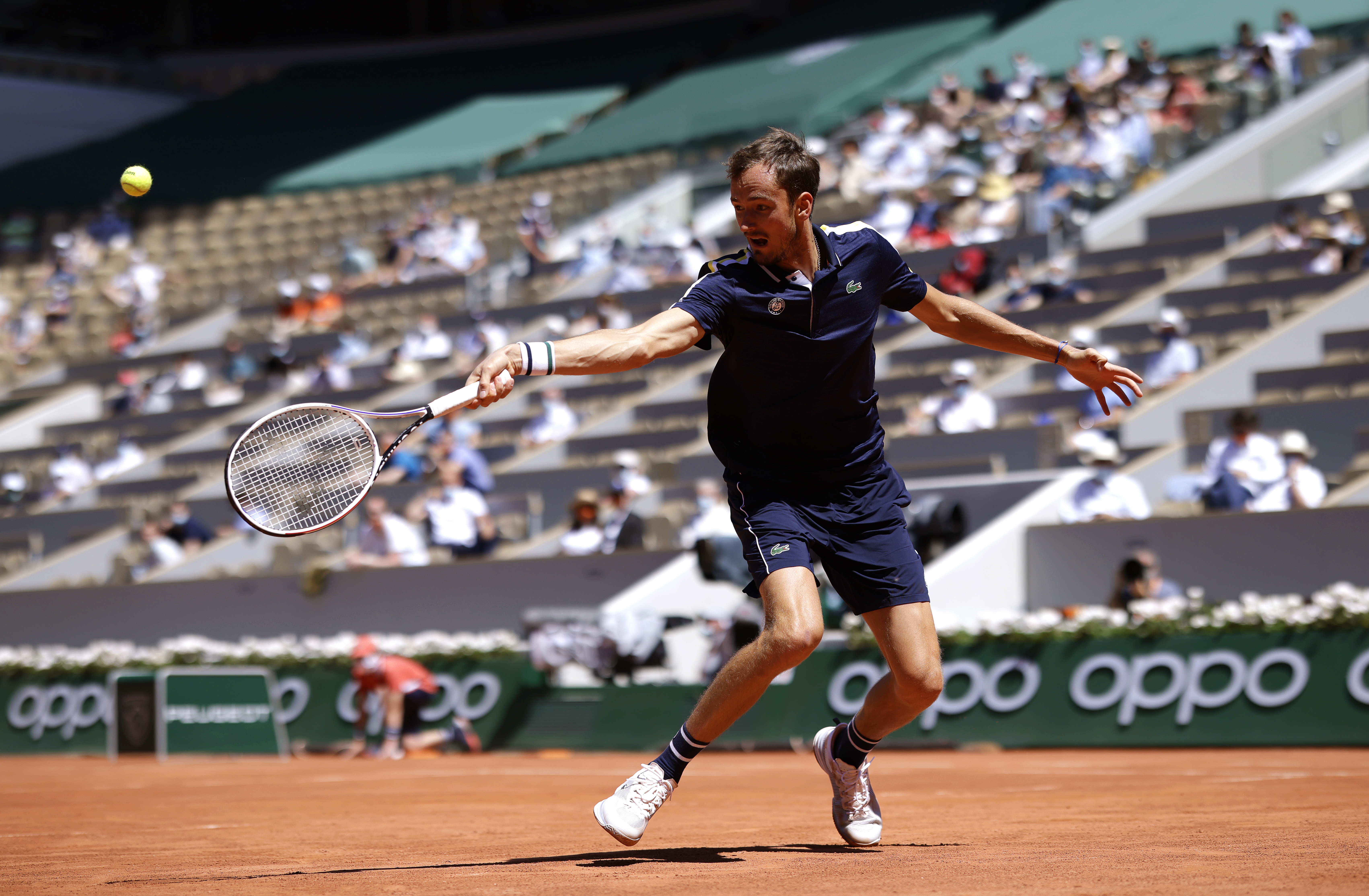 epa09238775 Daniil Medvedev of Russia in action against Alexander Bublik of Kazakhstan during their first round match at the French Open tennis tournament at Roland Garros in Paris, France, 31 May 2021.  EPA-EFE/YOAN VALAT
