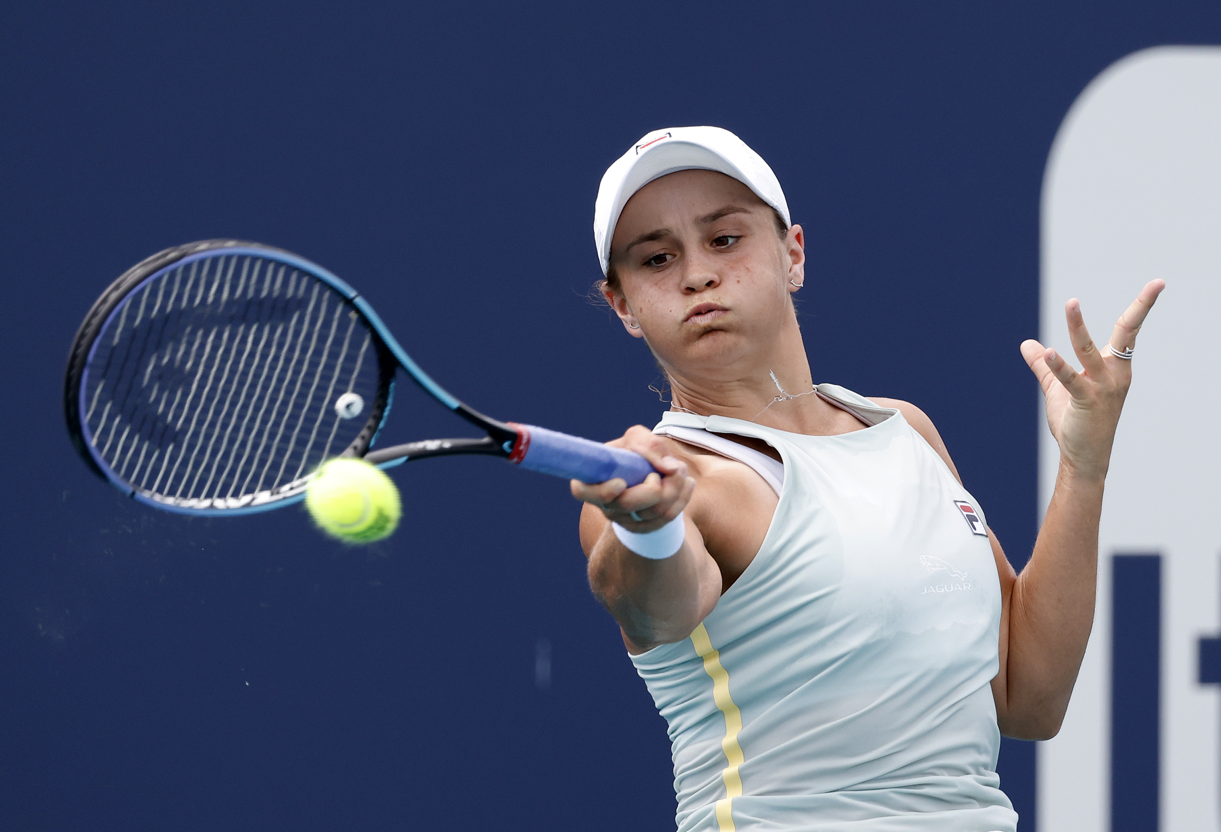 epa09105266 Ashleigh Barty of Australia in action against Victoria Azarenka of Belarus during their Women's singles match at the Miami Open tennis tournament in Miami Gardens, Florida, USA, 29 March 2021.  EPA-EFE/RHONA WISE