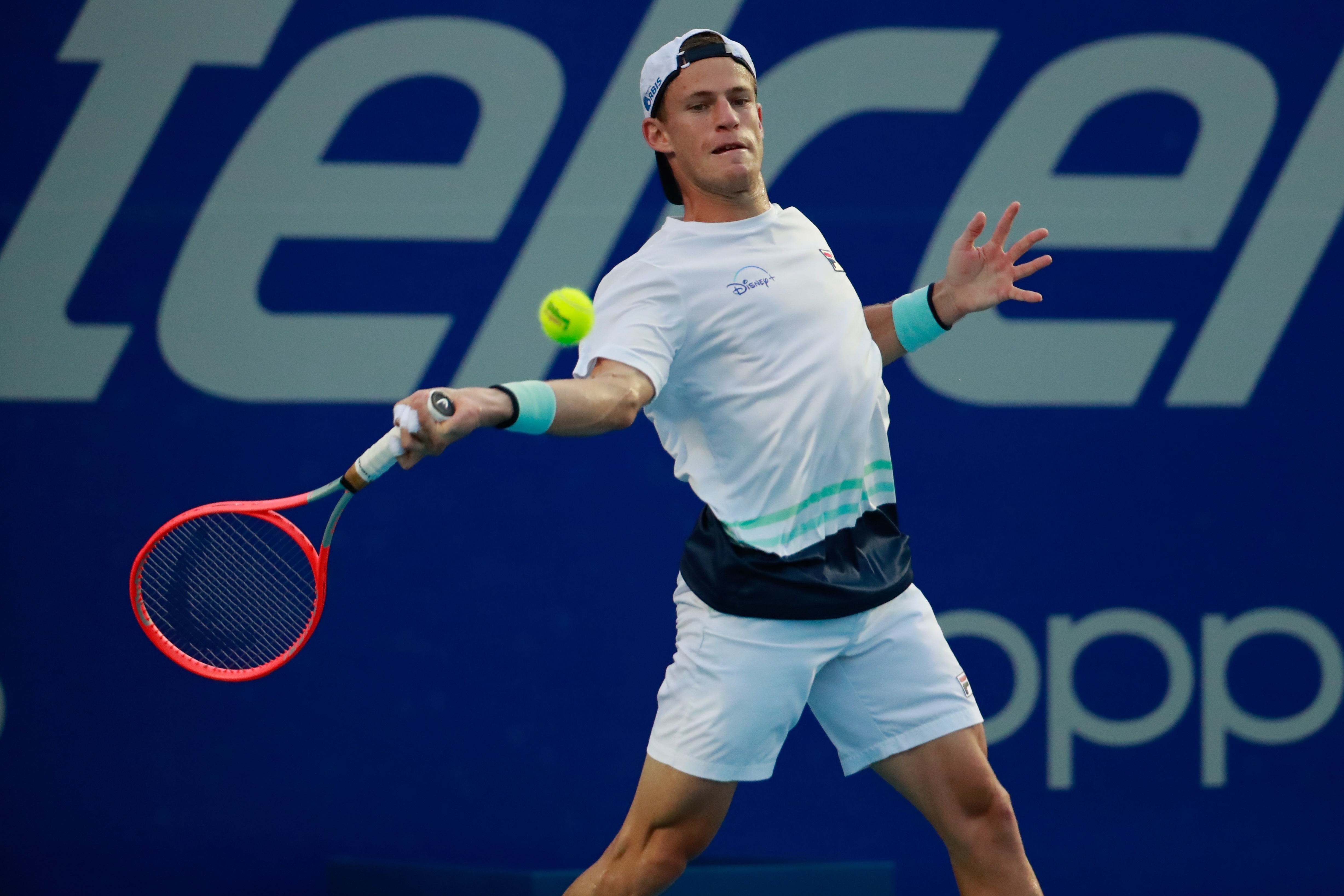 epa09078951 Diego Schwartzman of Argentina in action against Lorenzo Musetti of Italy during the second day of the Mexican Tennis Open in Acapulco, Guerrero state, Mexico, 16 March 2021.  EPA-EFE/David Guzman