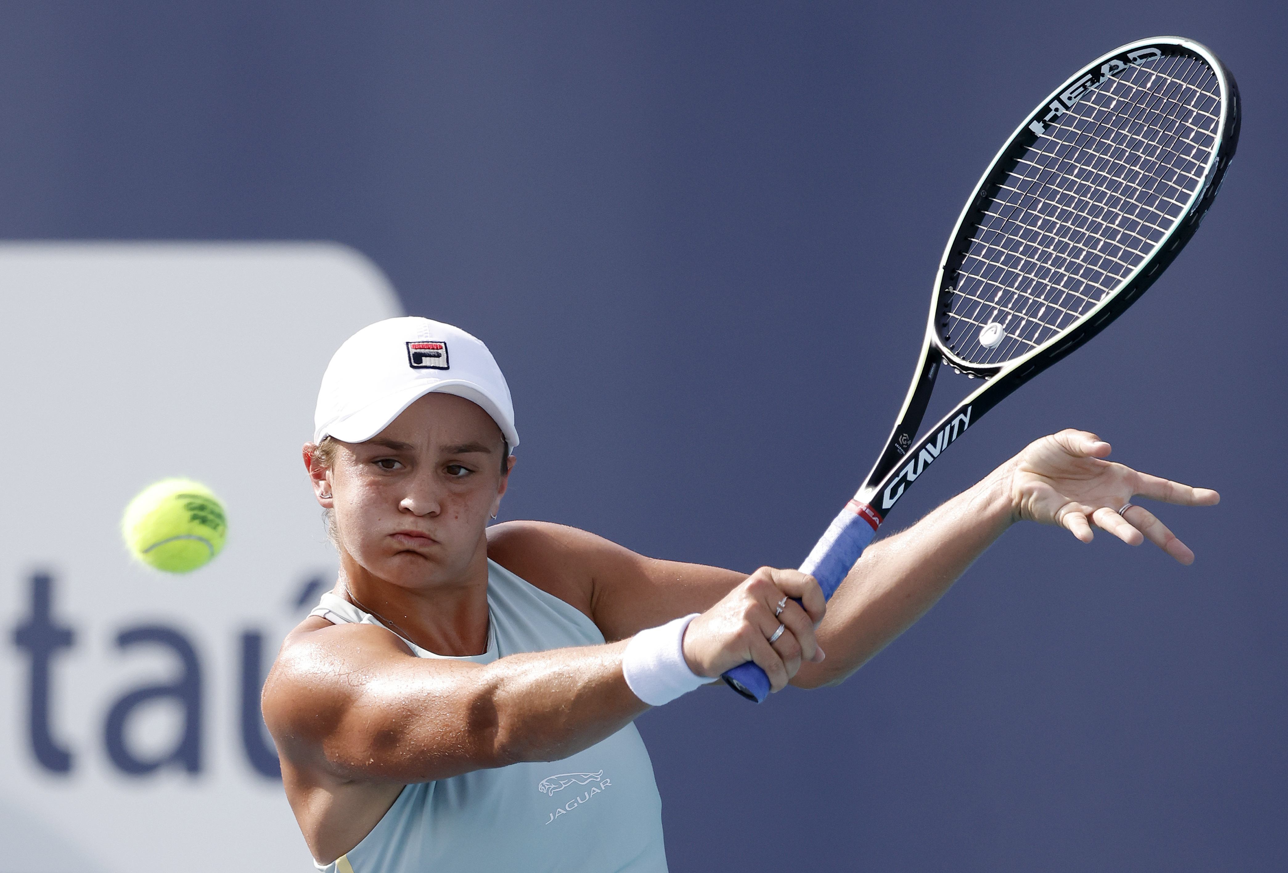 epa09111328 Ashleigh Barty of Australia in action against Elina Svitolina of Ukraine during their semi-final Women's singles match at the Miami Open tennis tournament in Miami Gardens, Florida, USA, 01 April 2021.  EPA-EFE/RHONA WISE