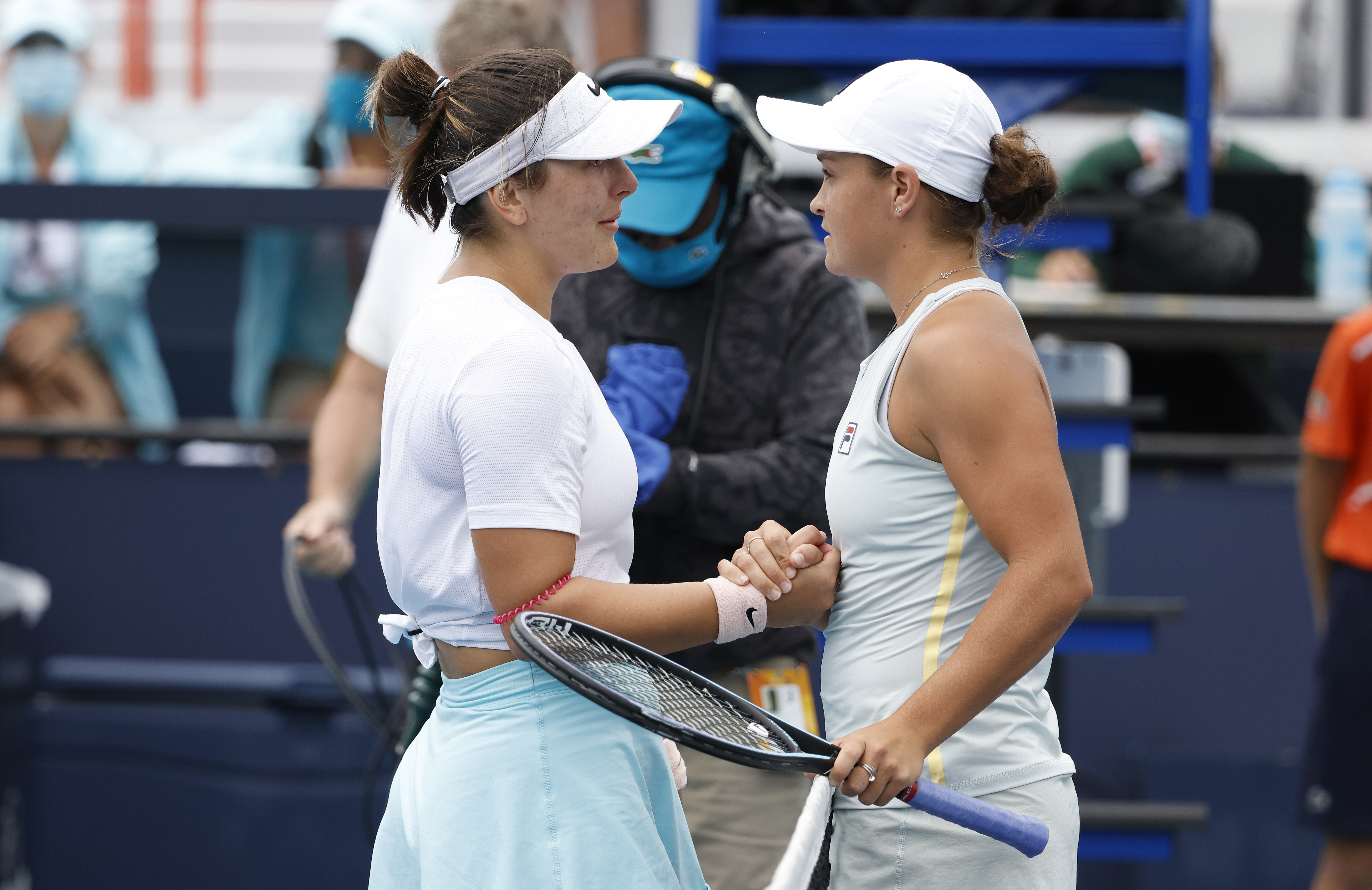 epa09114401 Bianca Andreescu of Canada (L) and Ashleigh Barty of Australia (R) meet at the net following their Women's singles finals match at the Miami Open tennis tournament in Miami Gardens, Florida, USA, 03 April 2021.  EPA-EFE/RHONA WISE