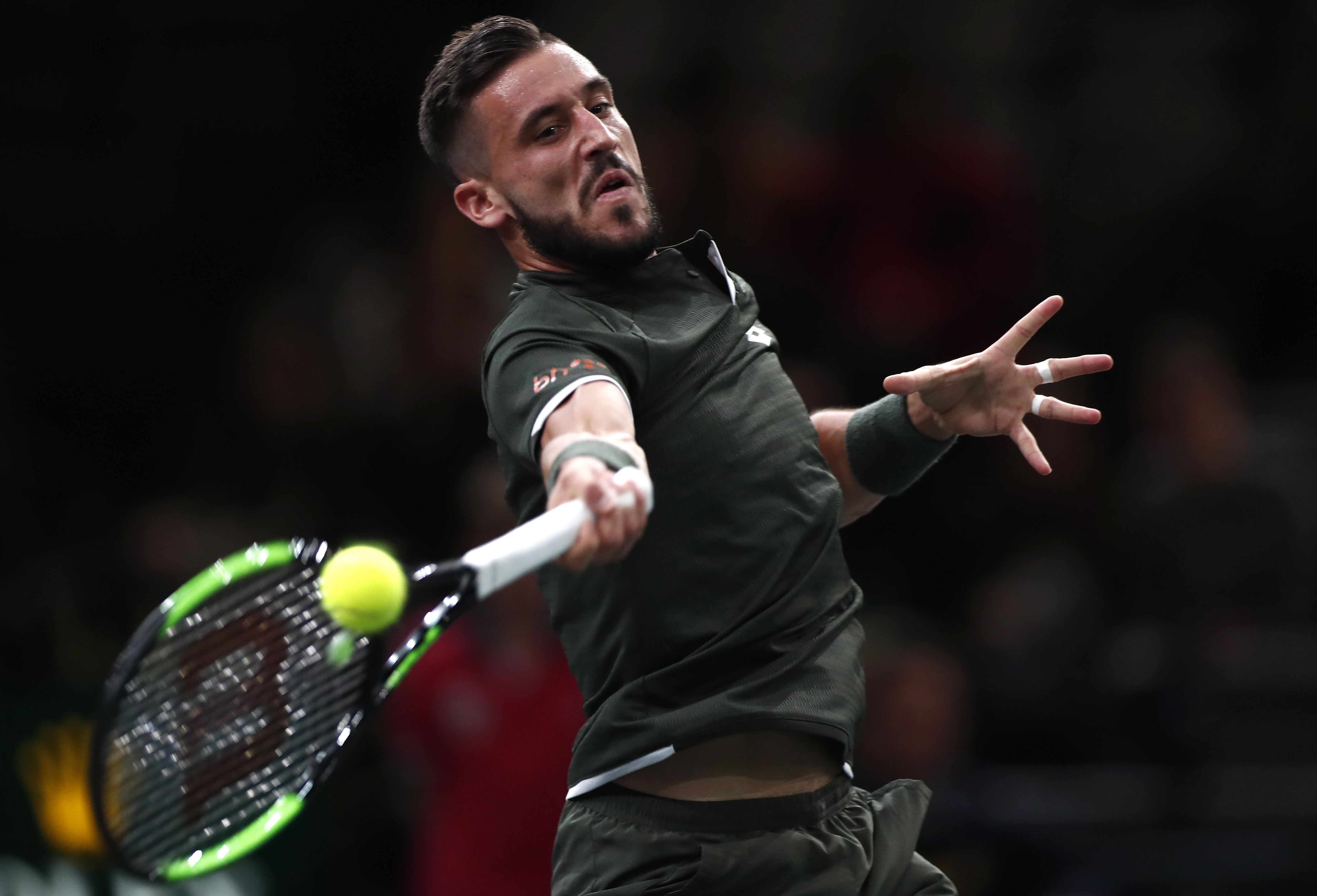 epa07956681 Damir Dzumhur of Bosnia Herzegovina in action during his match against Benoit Paire of France at the Rolex Paris Masters tennis tournament in Paris, France, 28 October 2019.  EPA-EFE/IAN LANGSDON