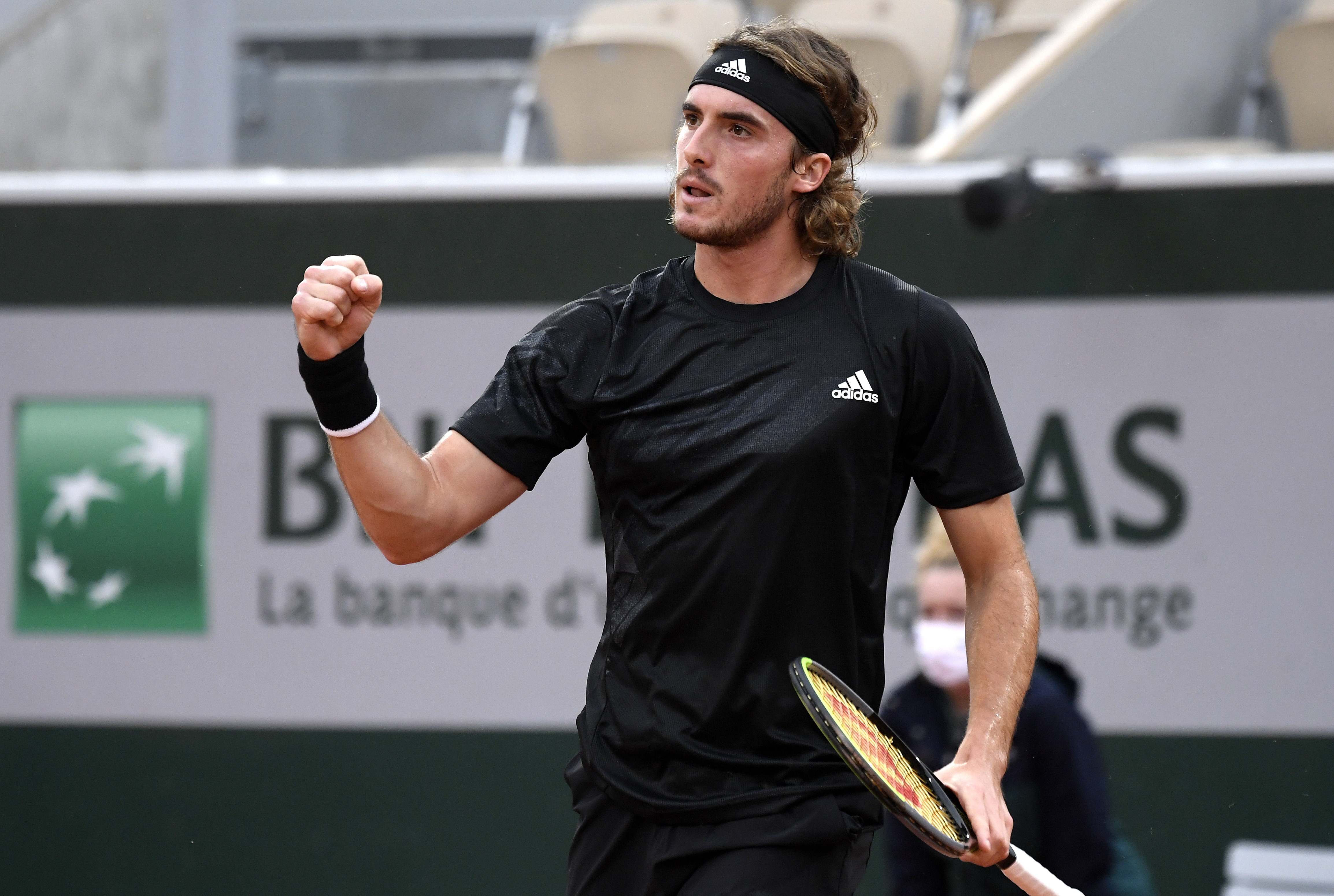 epa08706217 Stefanos Tsitsipas of Greece celebrates a point during his first round match against Jaume Munar of Spain during the French Open tennis tournament at Roland Garros in Paris, France, 29 September 2020.  EPA-EFE/JULIEN DE ROSA