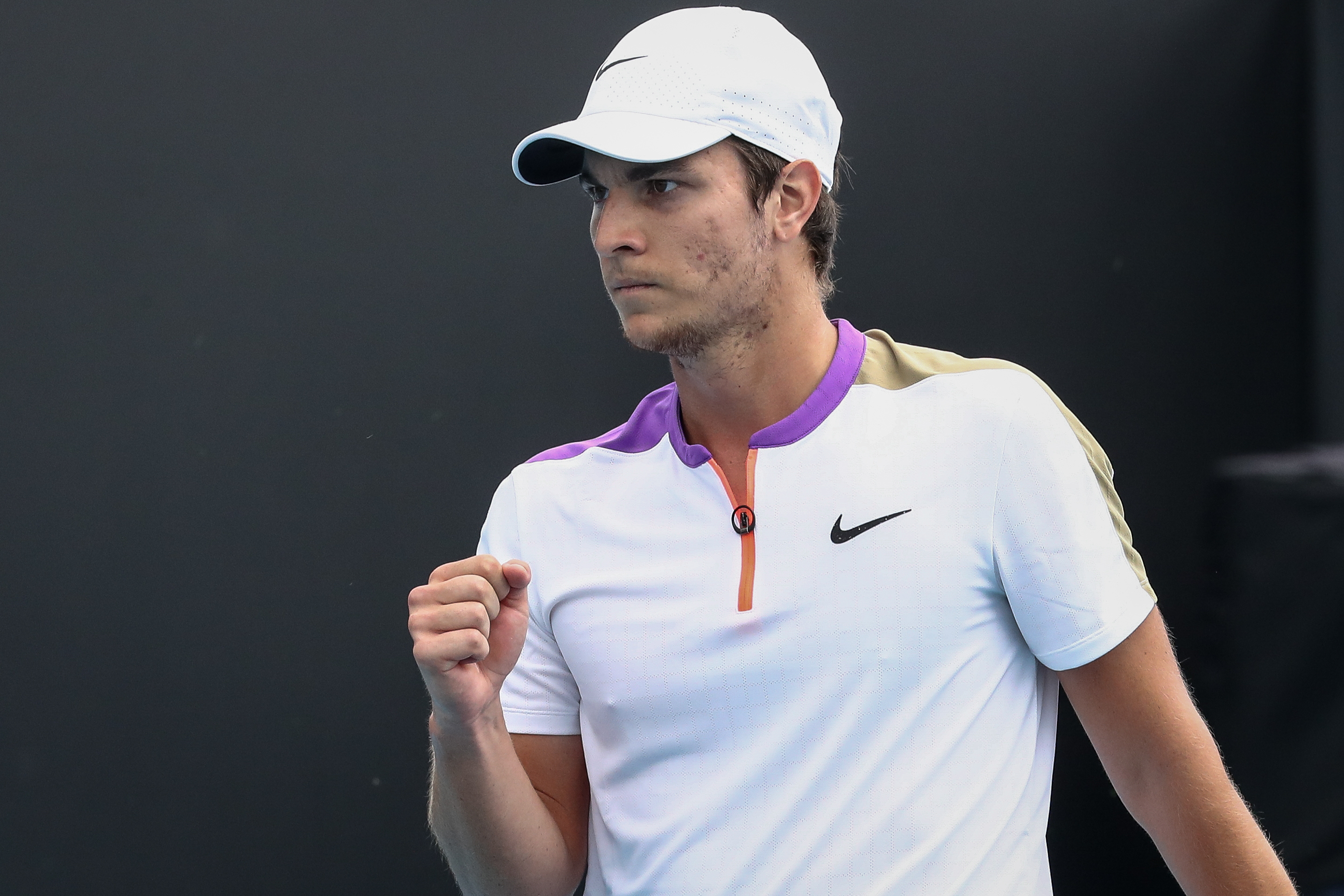 epa08995368 Miomir Kecmanovic of Serbia reacts during the men's singles tennis first round match against Kamil Majchrzak of Poland at the Australian Op?en Grand Slam at Melbourne Park in Melbourne, Australia, 08 February 2021.  EPA-EFE/JASON O'BRIEN