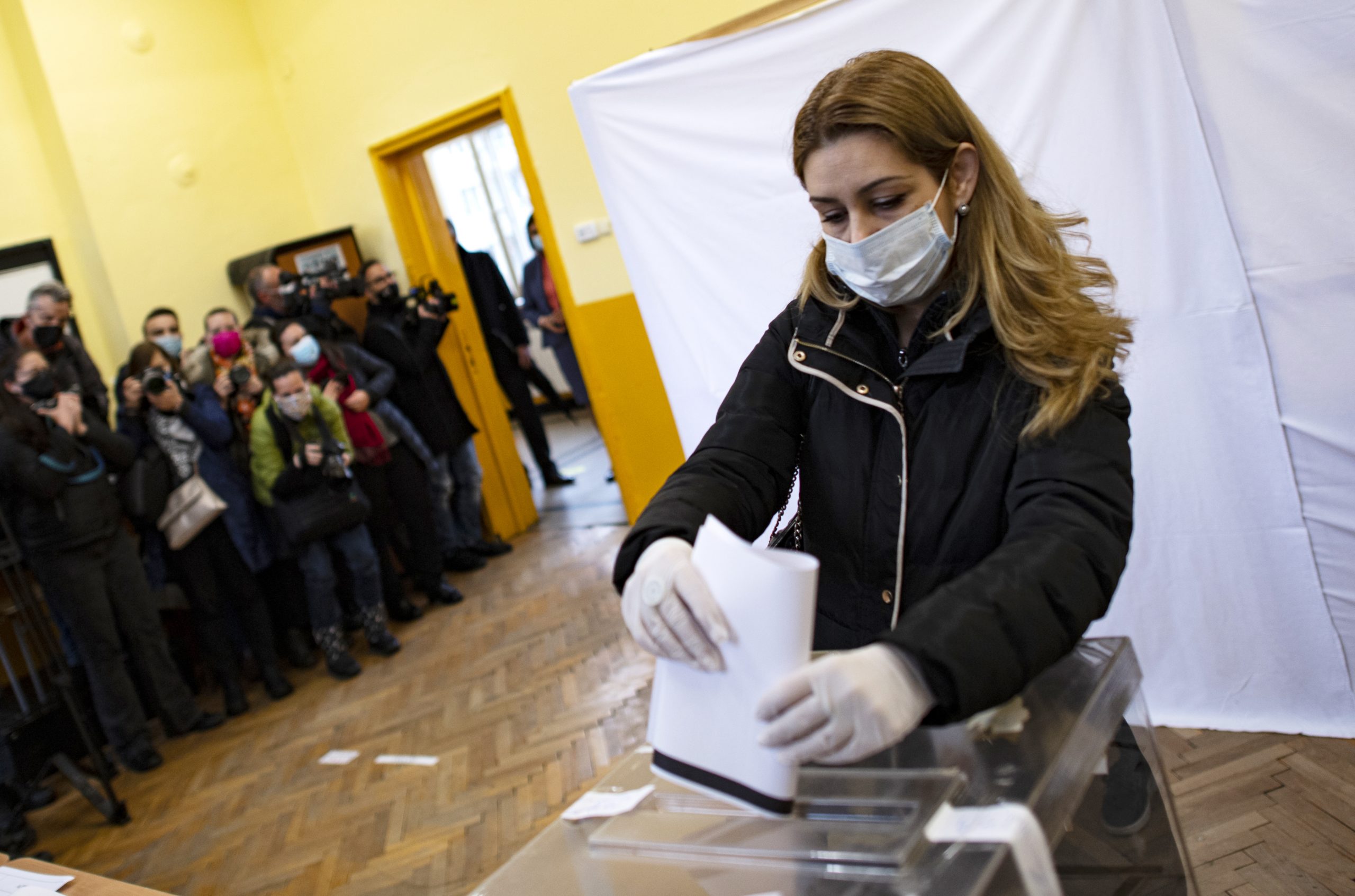 epa09114963 A woman casts her ballot at a polling station for the parliamentary elections in Sofia, Bulgaria, 04 April 2021.  EPA-EFE/VASSIL DONEV