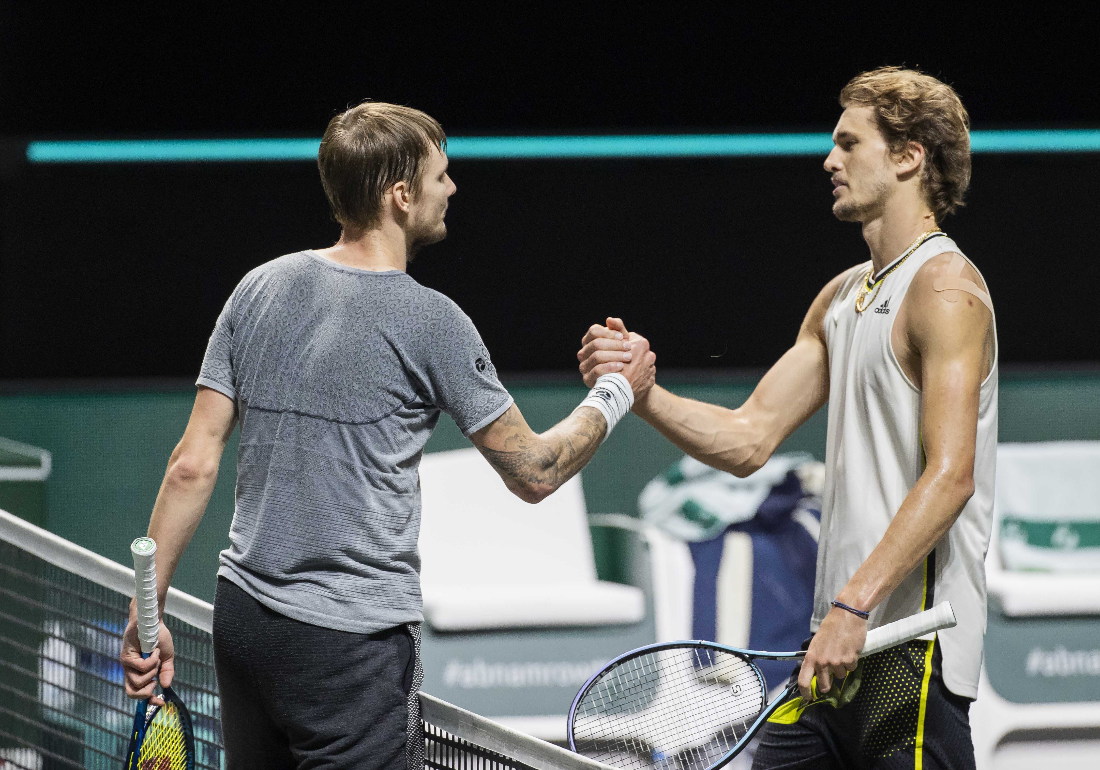 epa09048378 Alexander Bublik (L) of Kazakhstan greets Alexander Zverev of Germany after their match on the third day of the ABN AMRO World Tennis Tournament in Rotterdam, The Netherlands, 03 March 2021.  EPA-EFE/KOEN SUYK