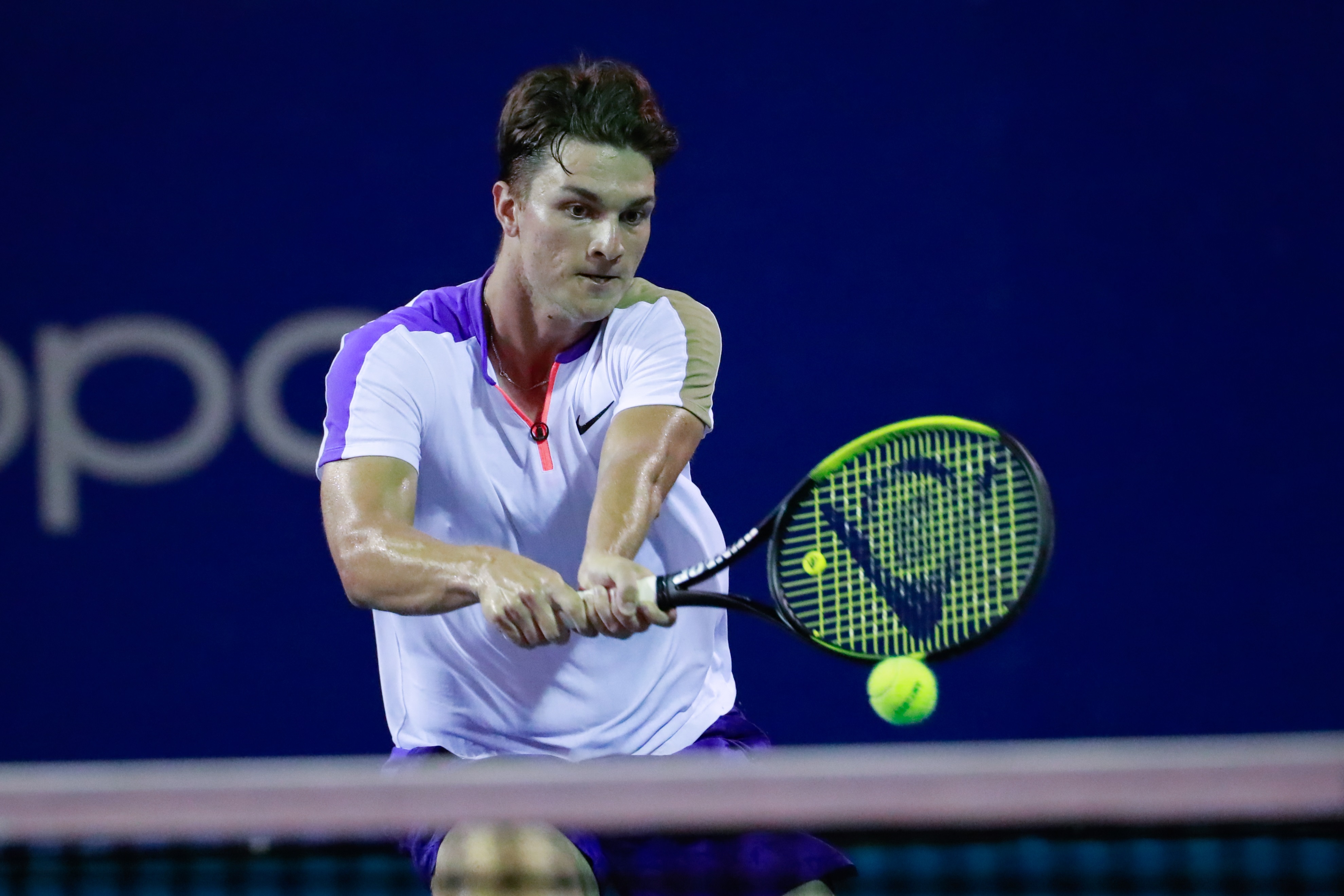epa09081019 Miomir Kecmanovic of Serbia in action against Grigor Dimitrov of Bulgaria during the third day of activities of the Mexican Tennis Open in Acapulco, Guerrero state, Mexico 17 March 2021.  EPA-EFE/David Guzman