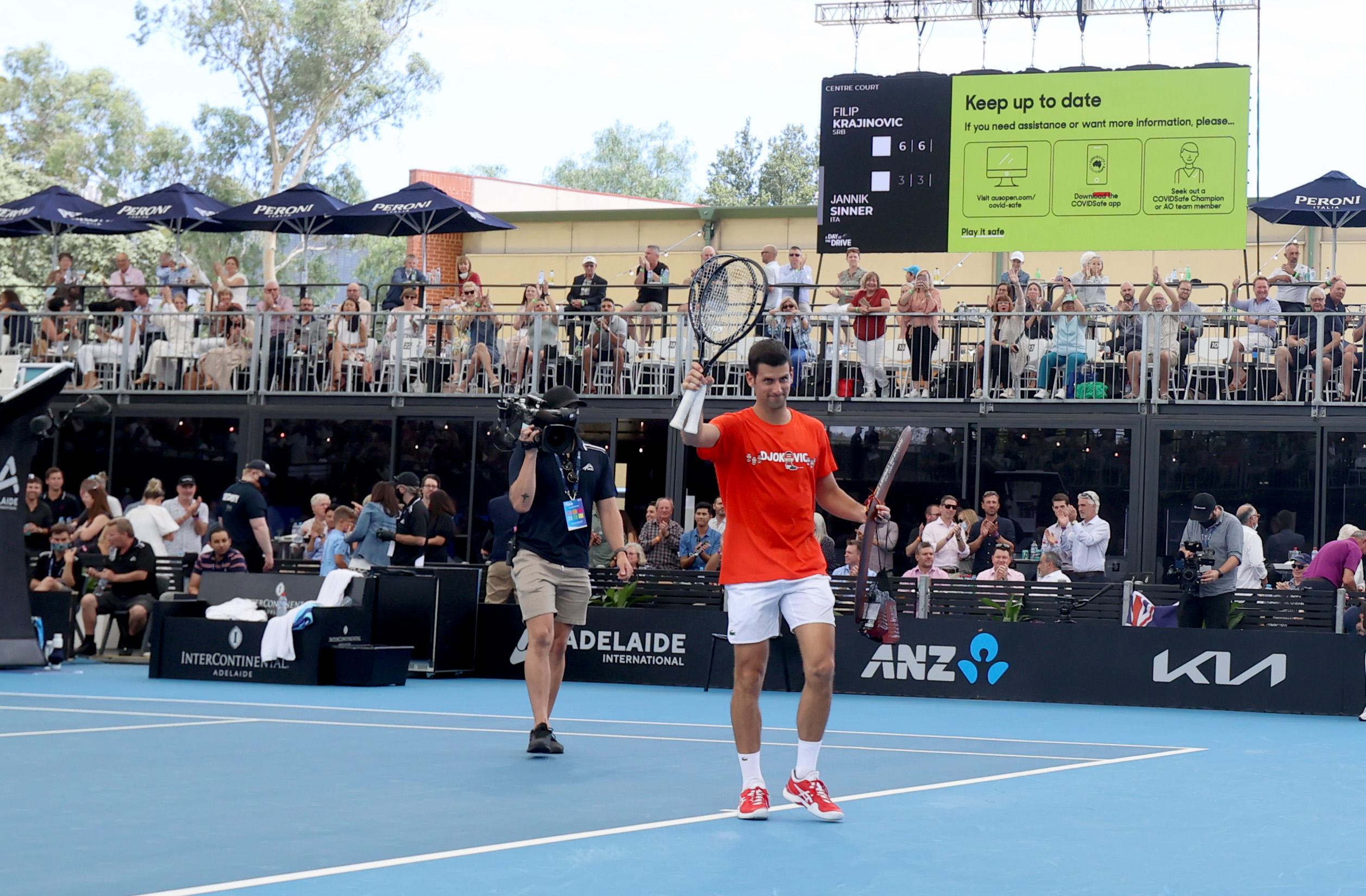 epa08972312 Novak Djokovic of Serbia acknowledges the crowd during the 'A Day at the Drive' tennis event at Memorial Drive Tennis Centre in Adelaide, Australia, 29 January 2021.  EPA-EFE/KELLY BARNES AUSTRALIA AND NEW ZEALAND OUT