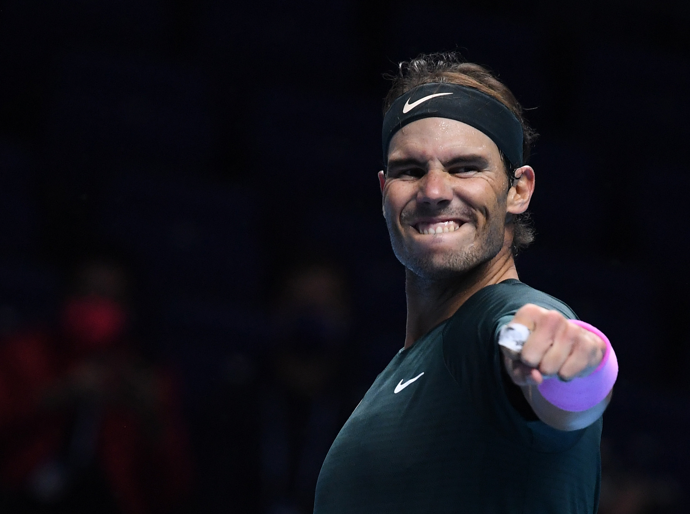 epa08830079 Rafael Nadal of Spain celebrates winning his group stage match against Stefanos Tsitsipas of Greece at the ATP Finals tennis tournament in London, Britain, 19 November 2020.  EPA-EFE/ANDY RAIN