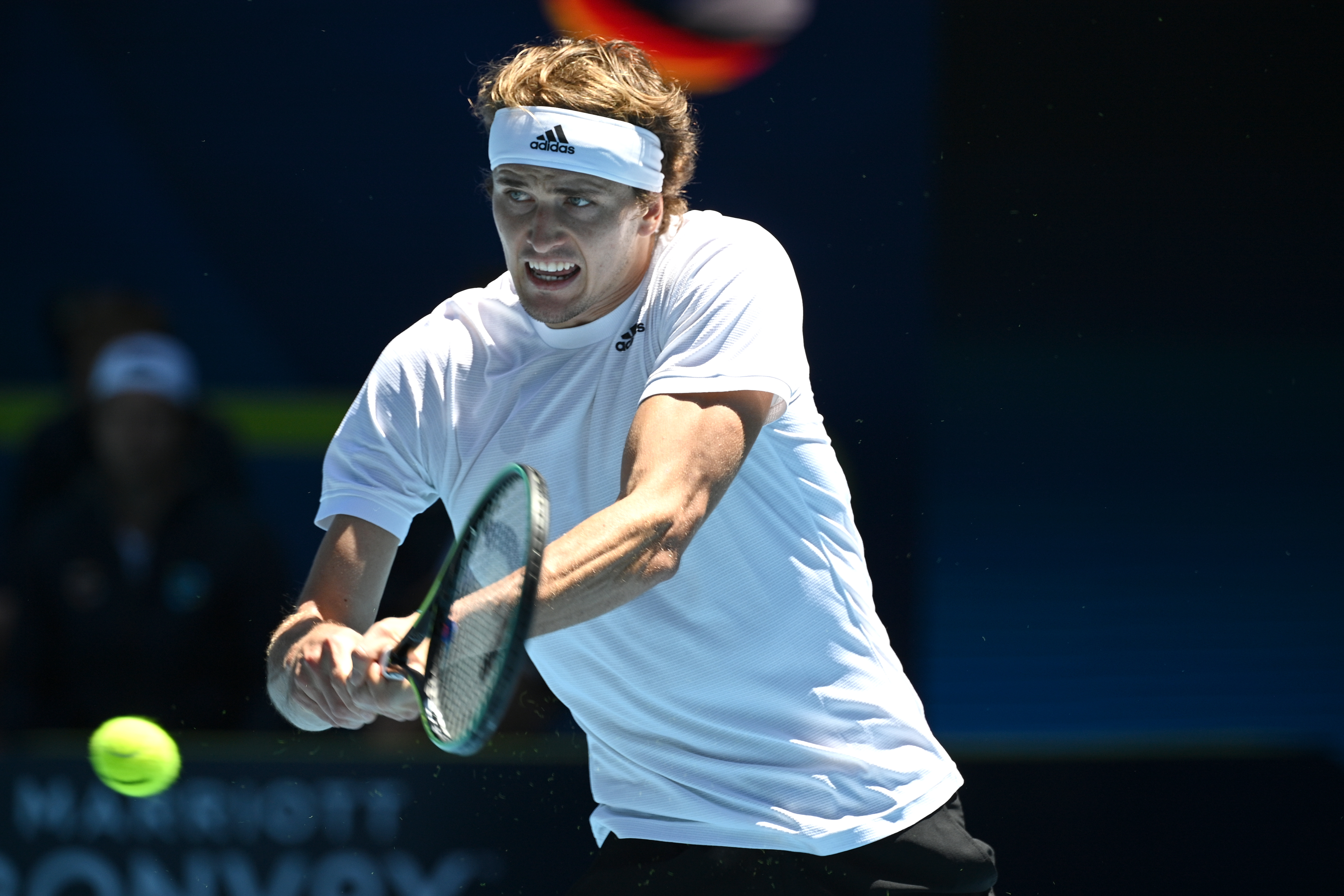 epa08982926 Alexander Zverev of Germany in action during the ATP Cup tennis match against Denis Shapovalov of Canada at Melbourne Park in Melbourne, Australia, 03 February 2021.  EPA-EFE/DEAN LEWINS EDITORIAL USE ONLY AUSTRALIA AND NEW ZEALAND OUT