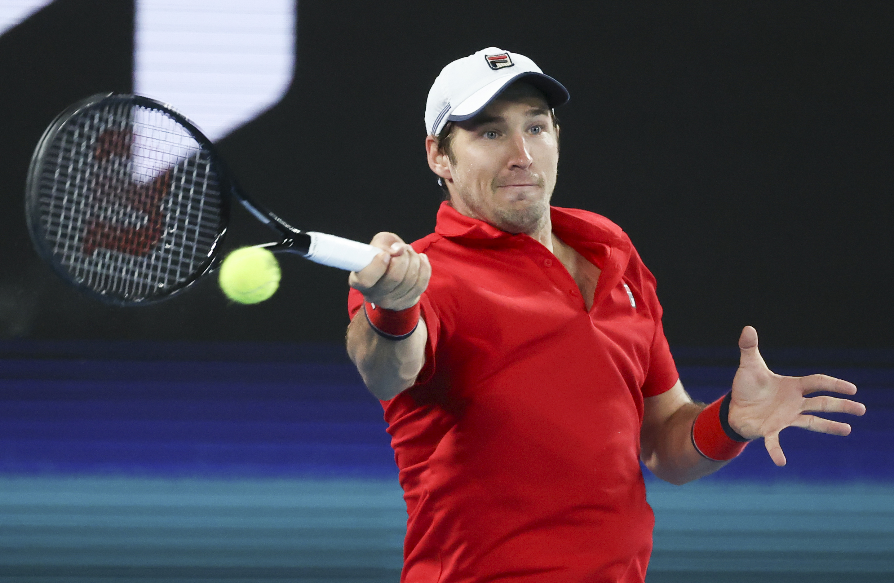 Serbia's Filip Krajinovic makes a forehand return during his match against Germany's Jan-Lennard Struff in their ATP Cup match in Melbourne, Australia, Friday, Feb. 5, 2021.(AP Photo/Hamish Blair)