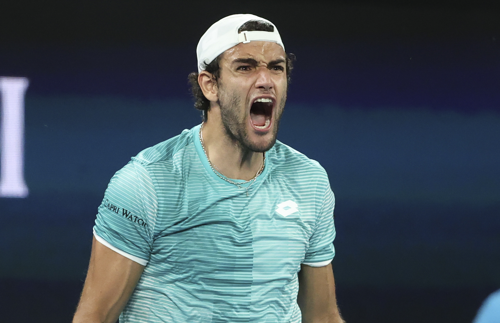 Italy's Matteo Berrettini celebrates after winning his match against Spain's Roberto Bautista Agut in their ATP Cup semifinal match in Melbourne, Australia, Saturday, Feb. 6, 2021.(AP Photo/Hamish Blair)