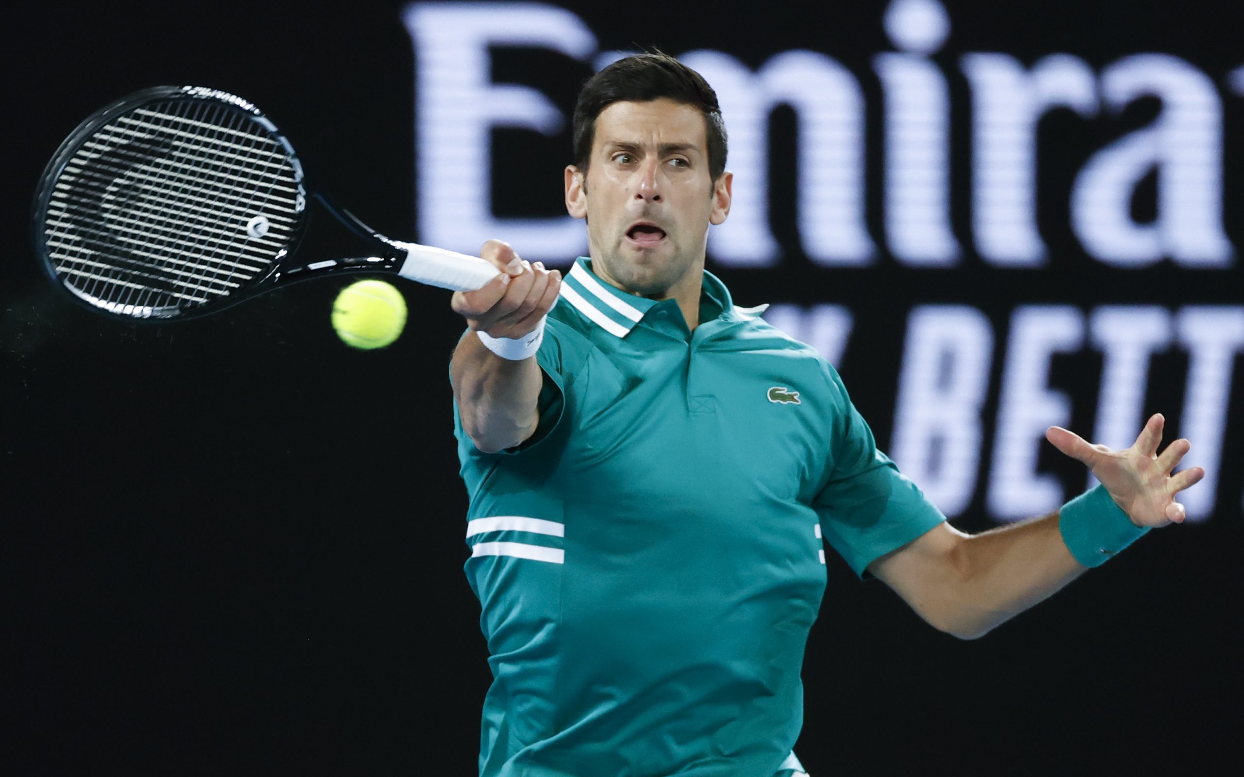 Serbia's Novak Djokovic makes a forehand return to France's Jeremy Chardy during their first round match at the Australian Open tennis championship in Melbourne, Australia, Monday, Feb. 8, 2021.(AP Photo/Rick Rycroft)