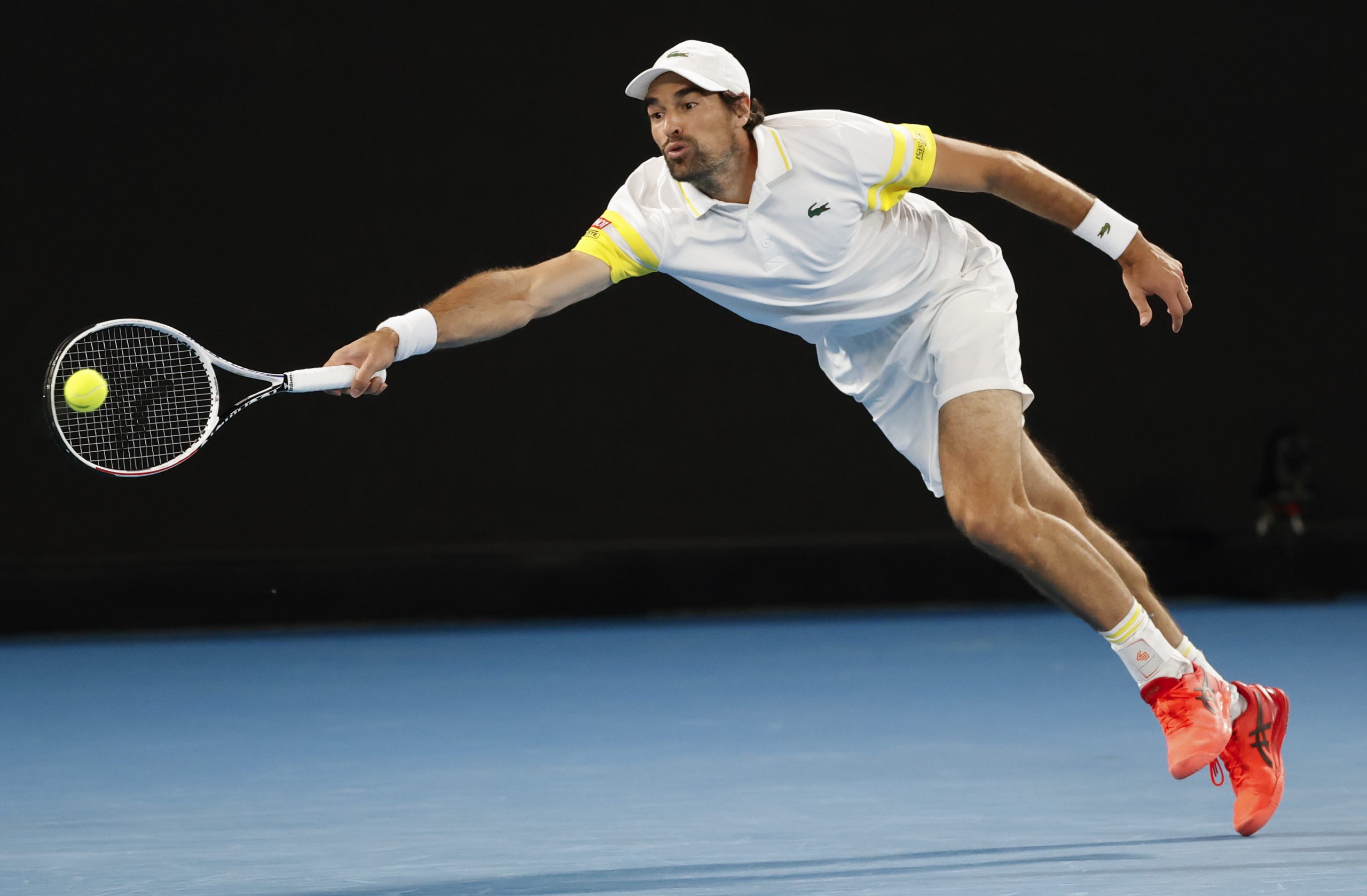 France's Jeremy Chardy makes a forehand return to Serbia's Novak Djokovic during their first round match at the Australian Open tennis championship in Melbourne, Australia, Monday, Feb. 8, 2021.(AP Photo/Rick Rycroft)