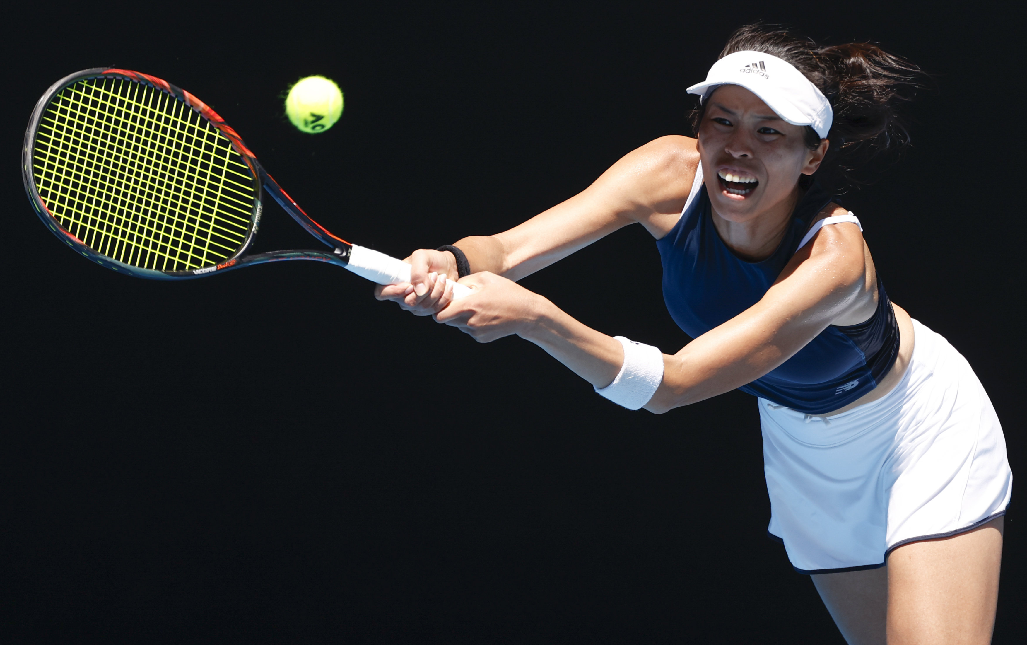 Taiwan's Hsieh Su-Wei makes a backhand return to Canada's Bianca Andreescu in their second round match at the Australian Open tennis championship in Melbourne, Australia, Wednesday, Feb. 10, 2021.(AP Photo/Rick Rycroft)