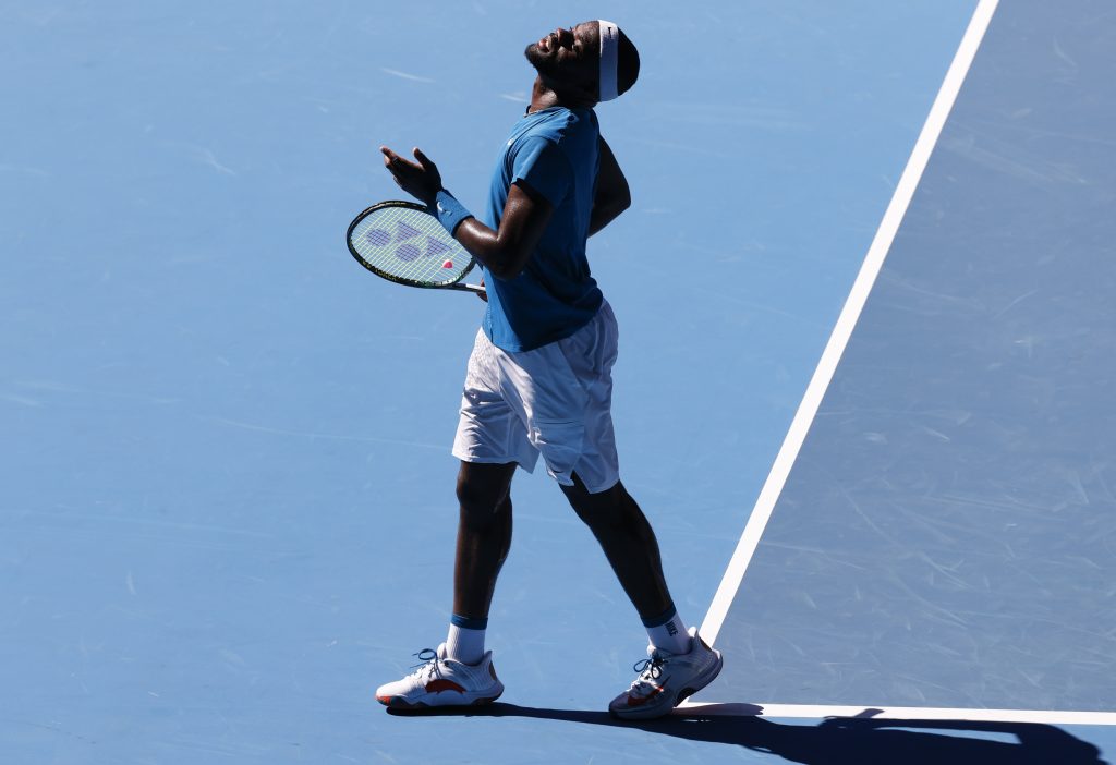 United States' Frances Tiafoe reacts during his second round match against Serbia's Novak Djokovic at the Australian Open tennis championship in Melbourne, Australia, Wednesday, Feb. 10, 2021.(AP Photo/Rick Rycroft)