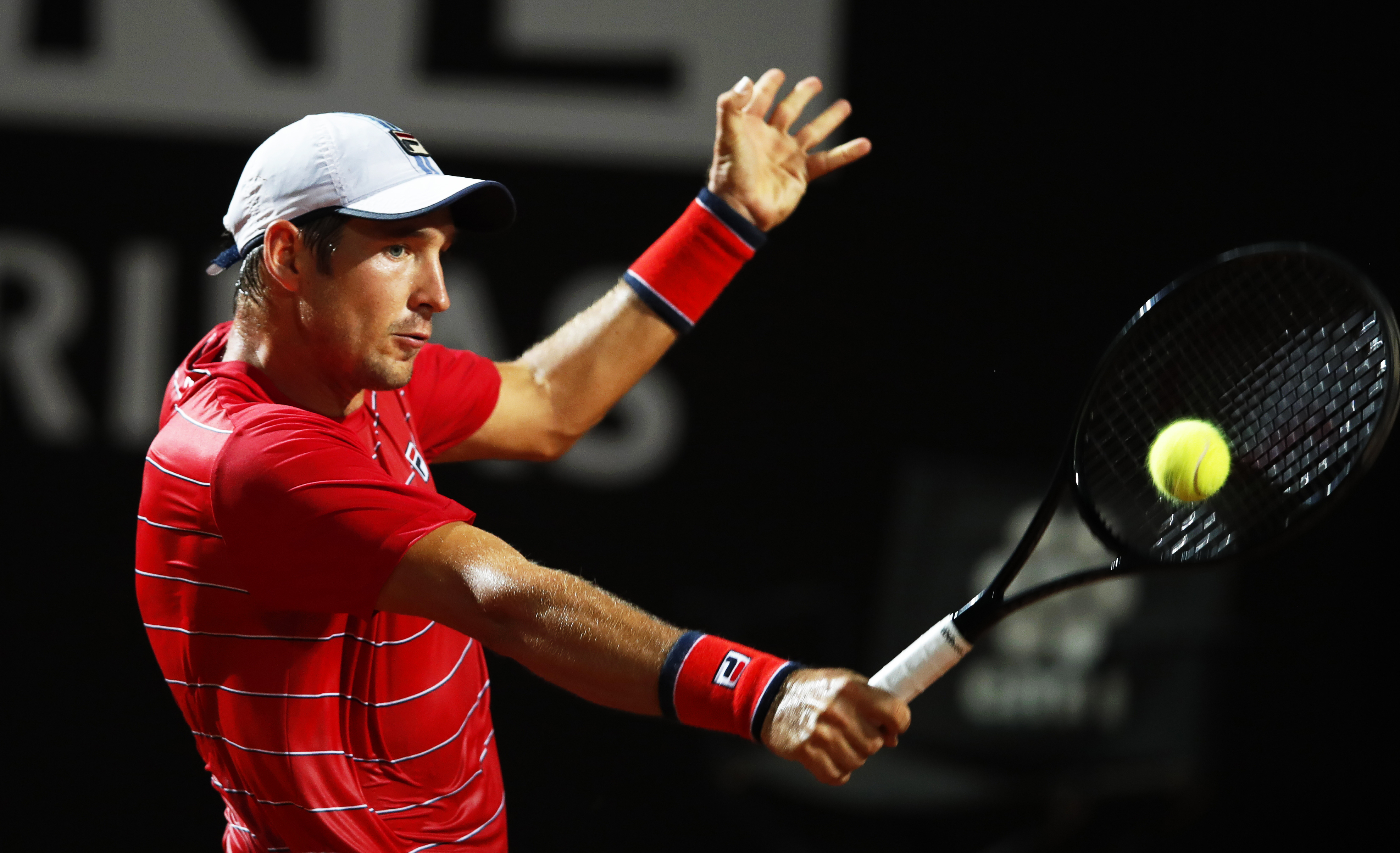 epa08679329 Dusan Lajovic of Serbia in action against Rafael Nadal of Spain during their men's singles third round match at the Italian Open tennis tournament in Rome, Italy, 18 September 2020.  EPA-EFE/Clive Brunskill / POOL