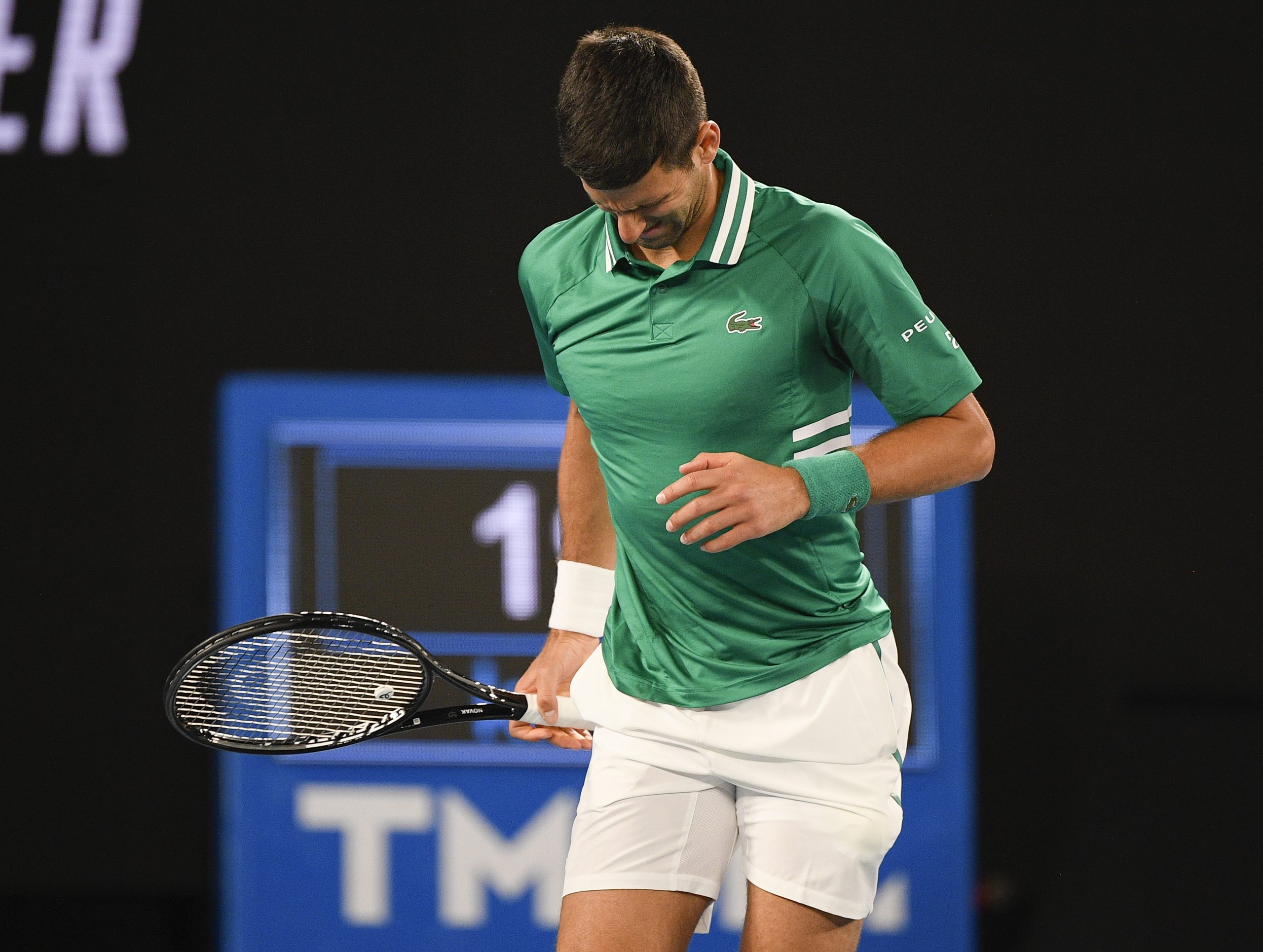 Serbia's Novak Djokovic reacts during his third round match against United States' Talyor Fritz at the Australian Open tennis championship in Melbourne, Australia, Friday, Feb. 12, 2021.(AP Photo/Andy Brownbill)