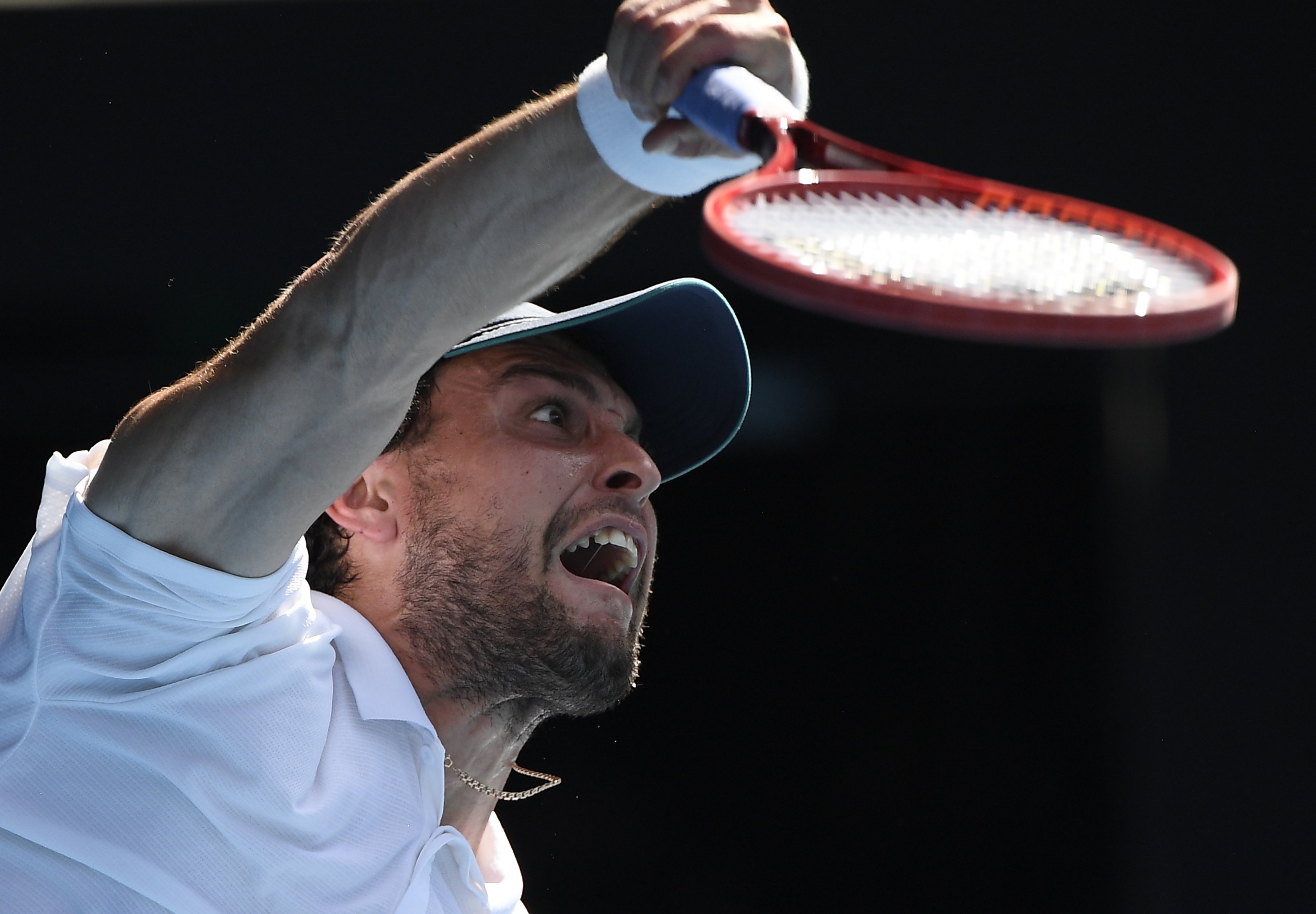 Russia's Aslan Karatsev serves to Bulgaria's Grigor Dimitrov during their quarterfinal match at the Australian Open tennis championship in Melbourne, Australia, Tuesday, Feb. 16, 2021.(AP Photo/Andy Brownbill)